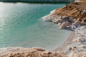 Turquoise water meets salt-encrusted shore