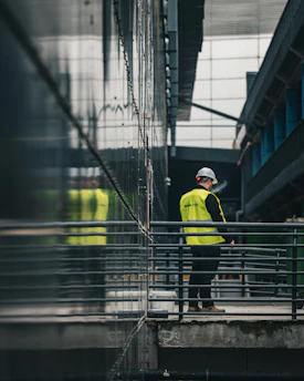 Construction worker in reflective vest on walkway