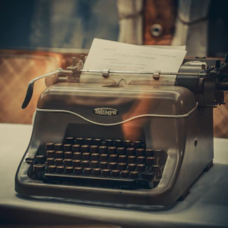Vintage typewriter with paper on a table