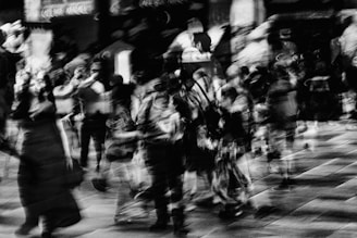 Blurred figures in a crowd at night