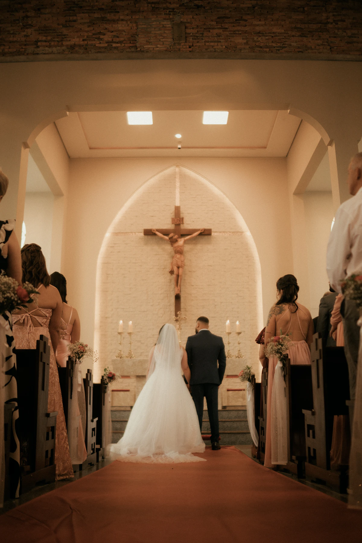 Wedding couple standing at an altar