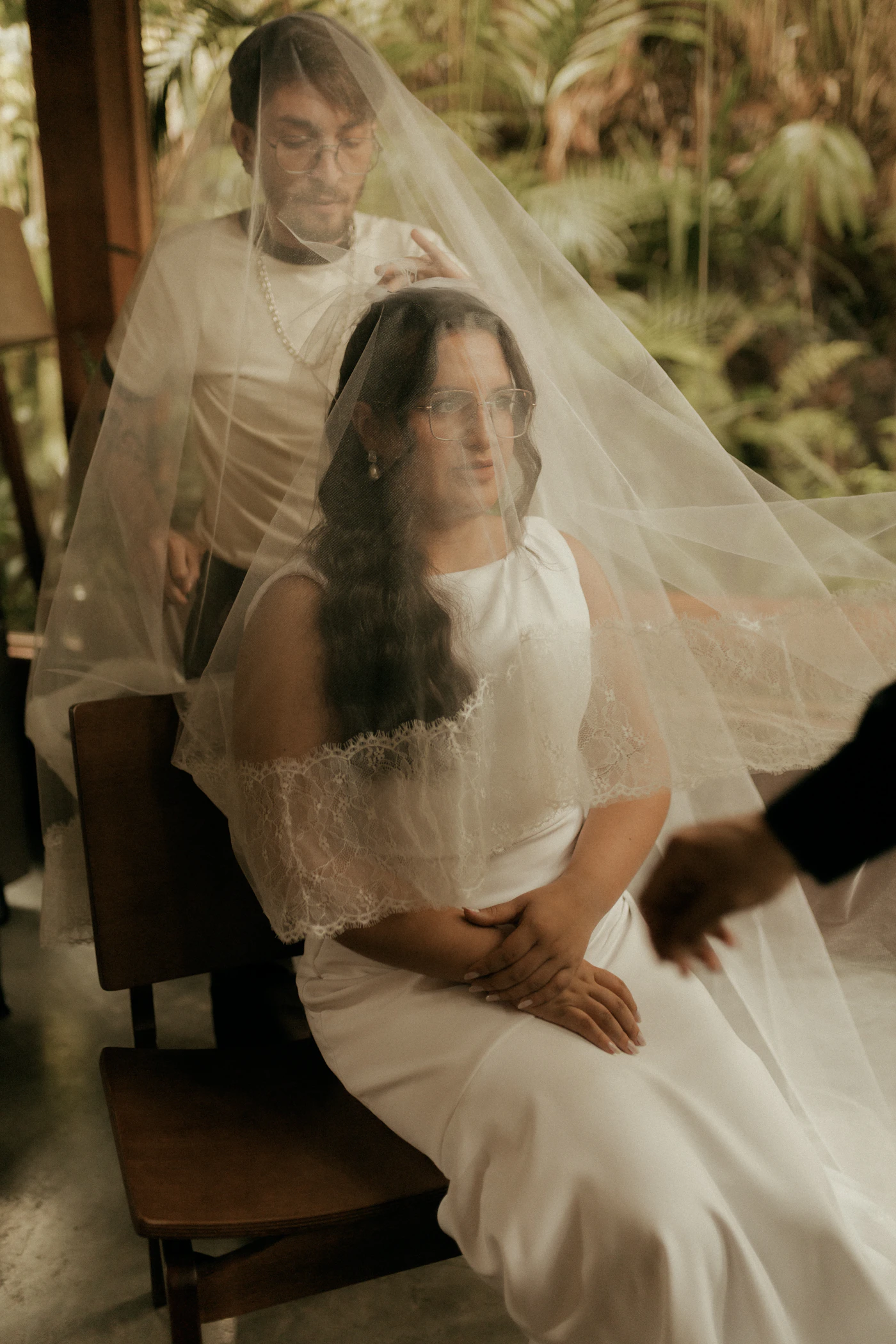 Couple with a bird guide in the Mindo cloud forest reserve searching for endemic species after their elopement ceremony
