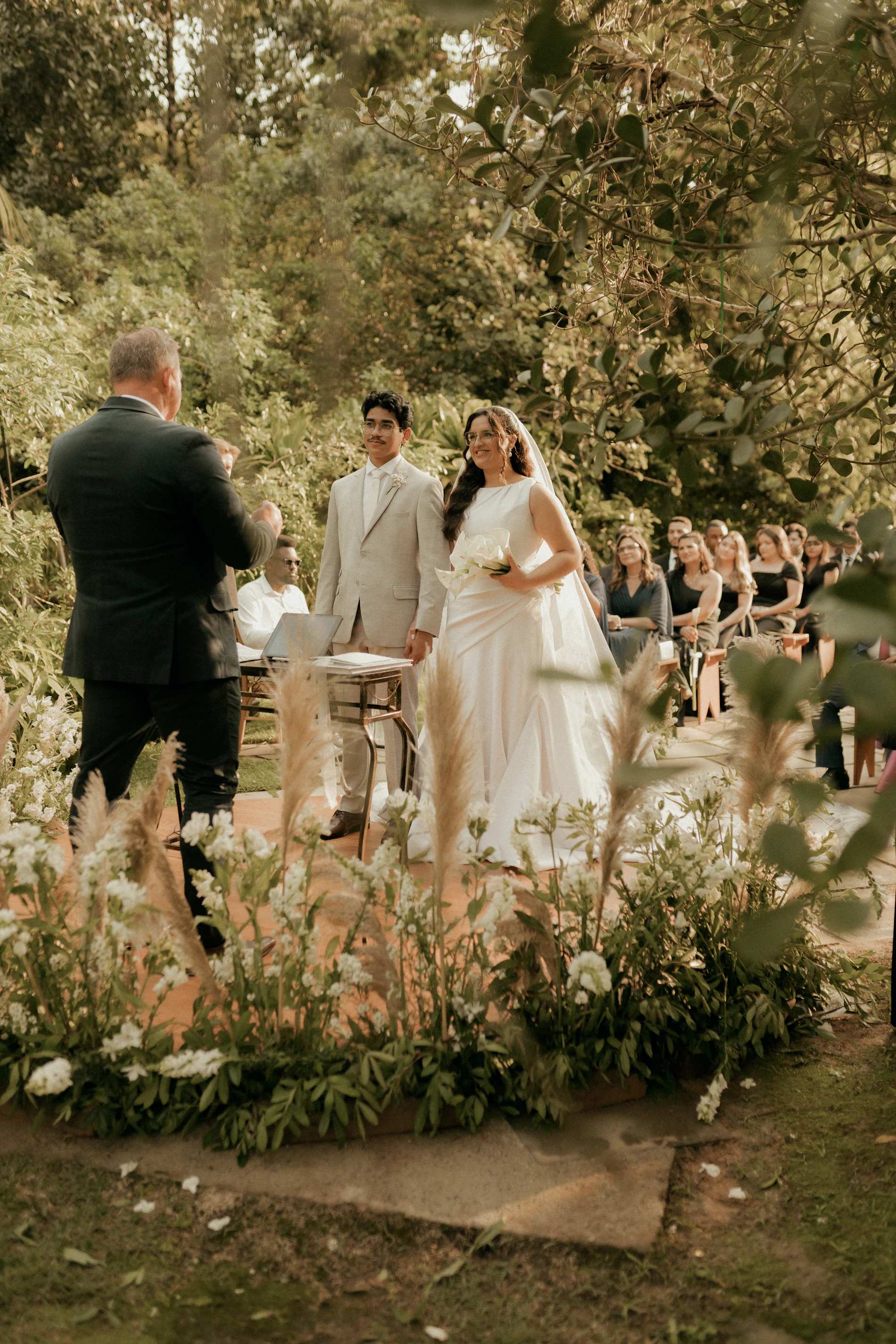 Bride and groom at an elegant outdoor wedding ceremony