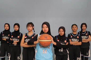 A group of young women in basketball uniforms