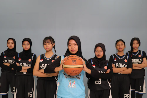 Group of young women in basketball uniforms