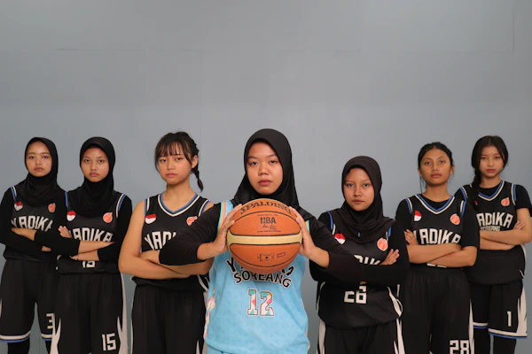 Group of young women in basketball uniforms