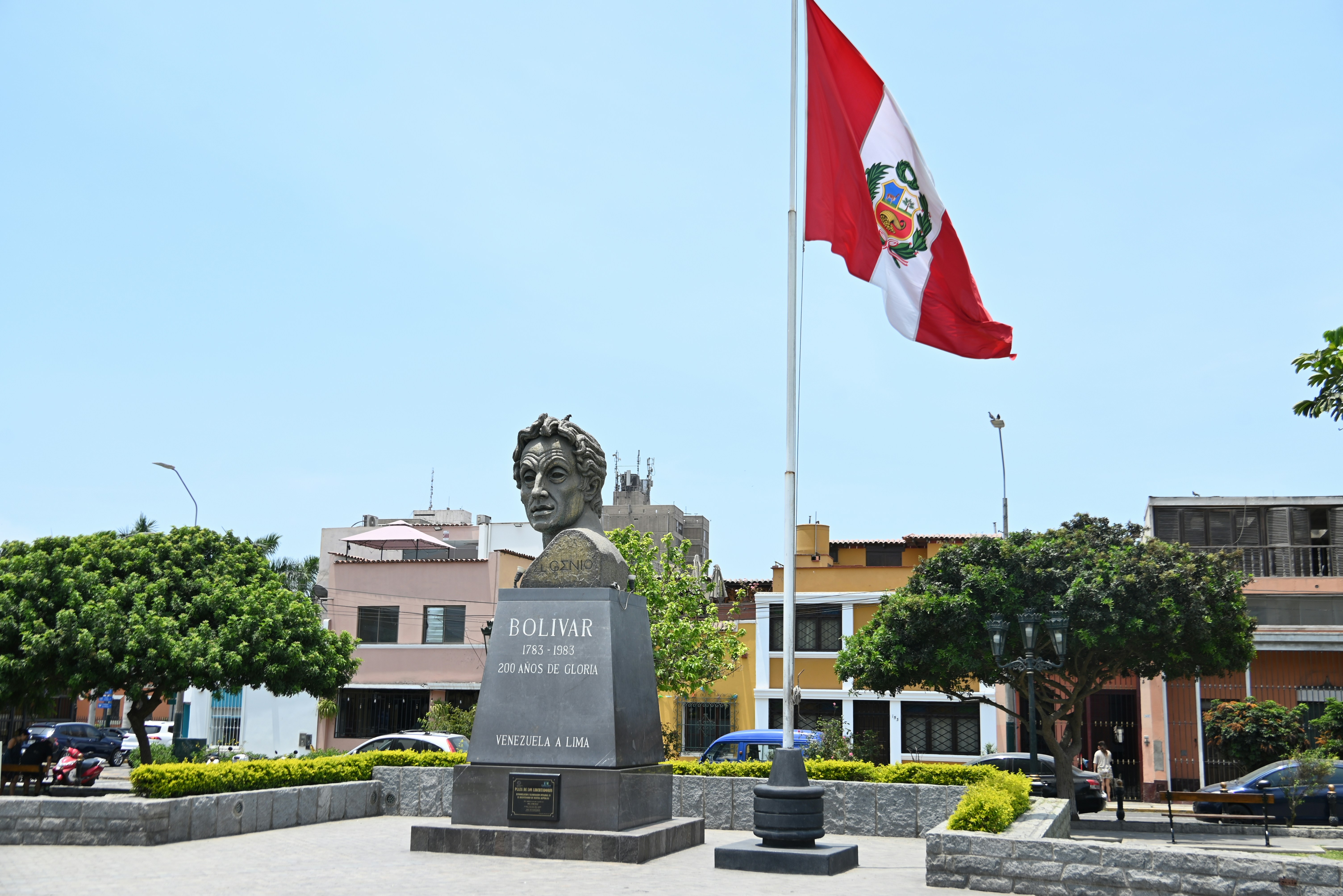 Bust of jose diaz with peruvian flag flying