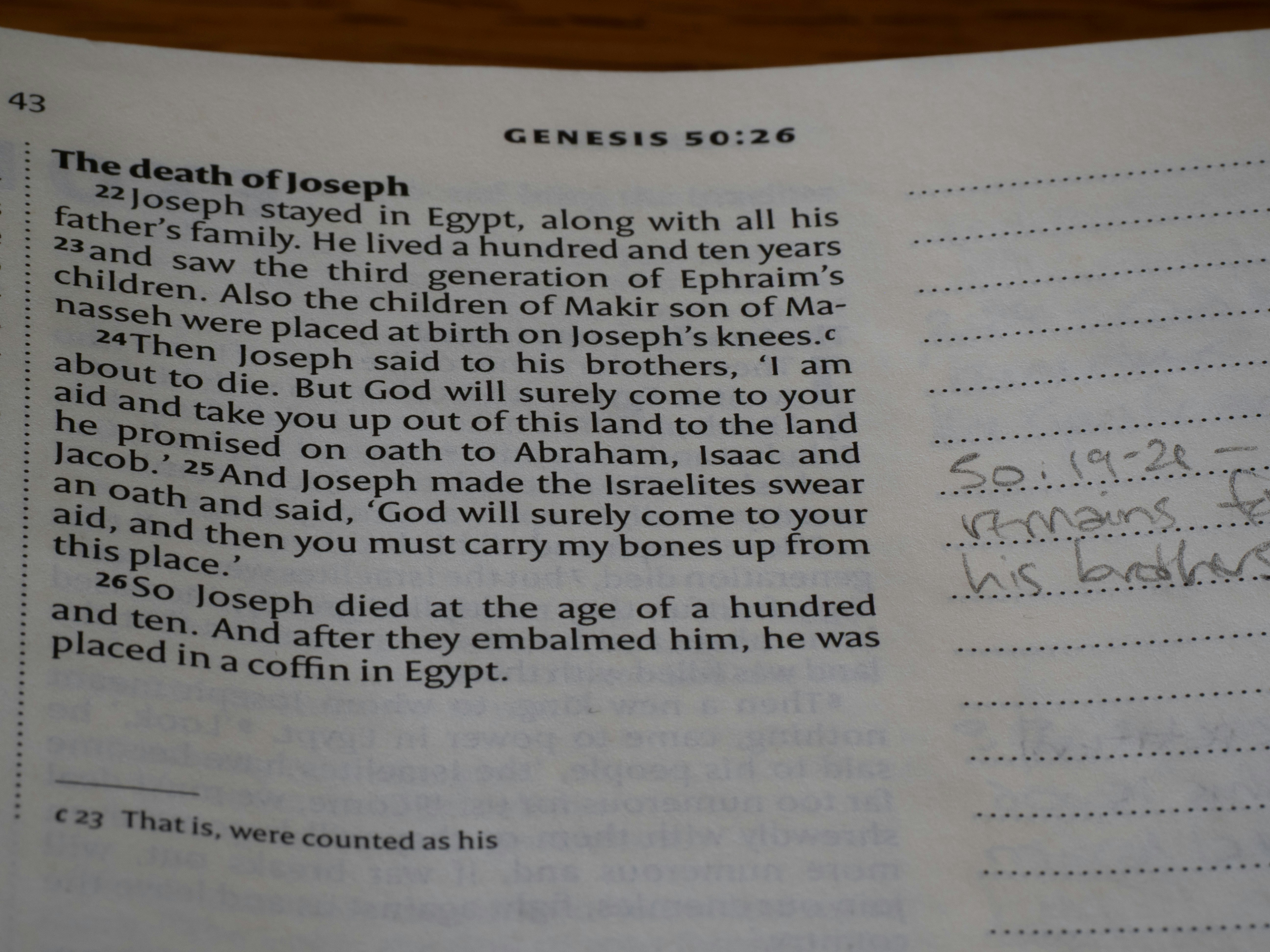 A page from a bible with text and handwritten notes.