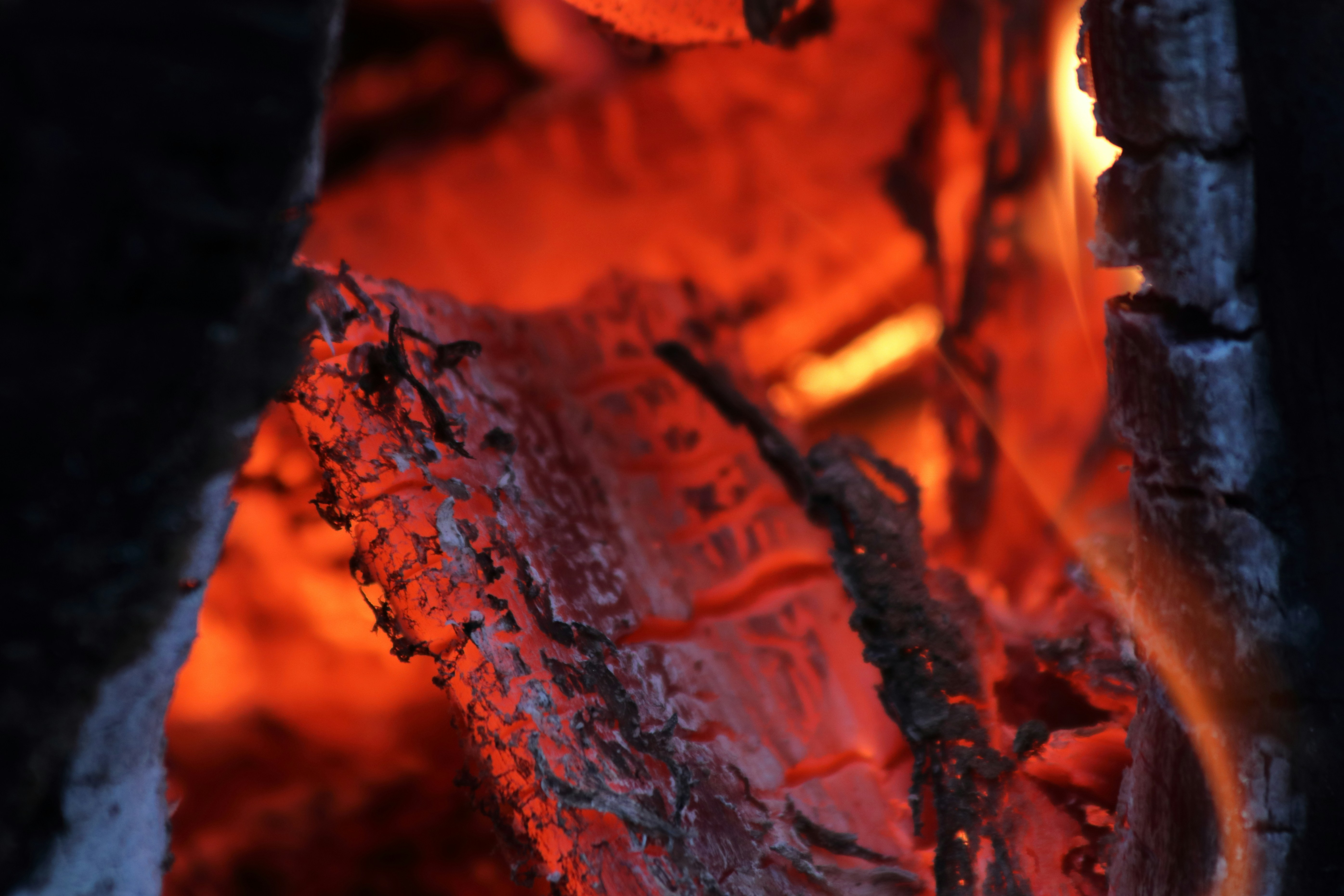 Close up of glowing embers and burning wood
