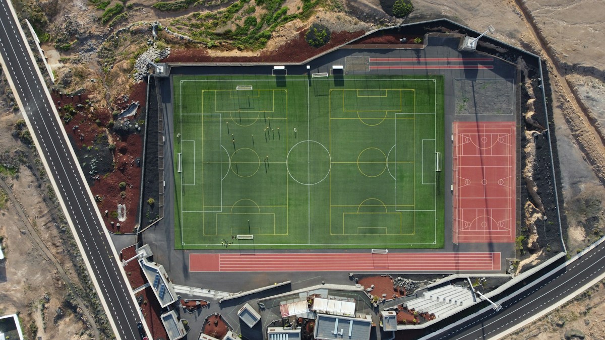 Aerial view of a sports complex with multiple soccer fields, ideal for planning a youth sports concession stand setup.
