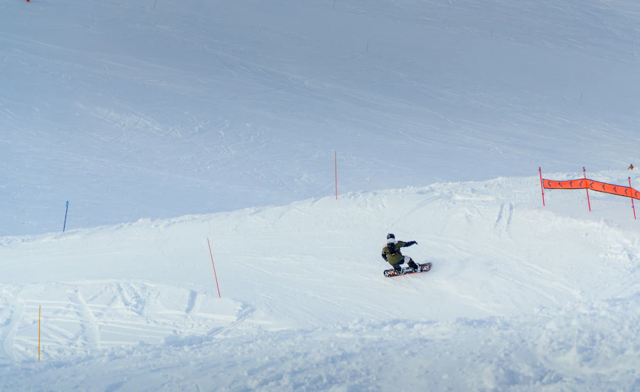 Snowboarder jumping in the mountains