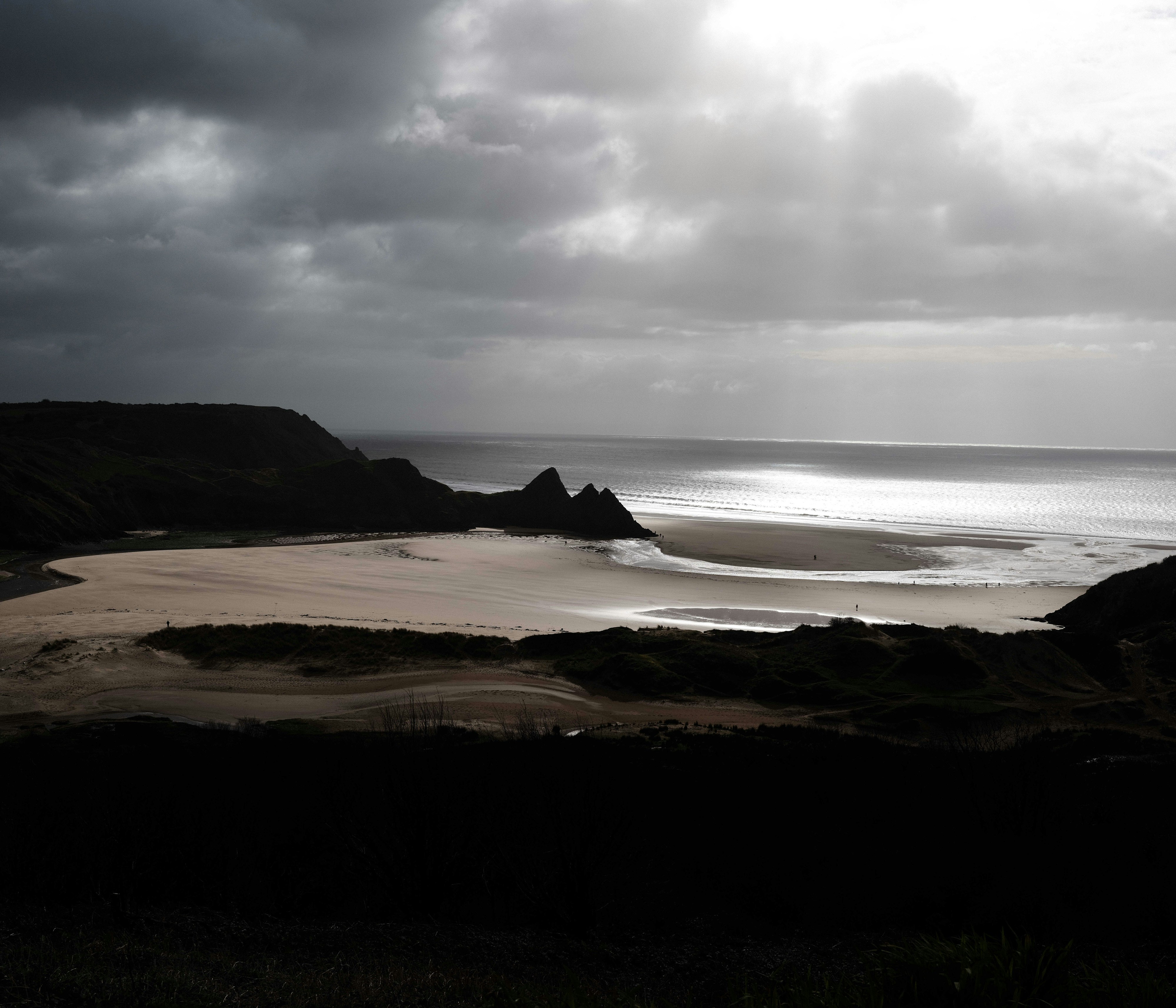 Dramatic cloudy sky over a sandy beach landscape