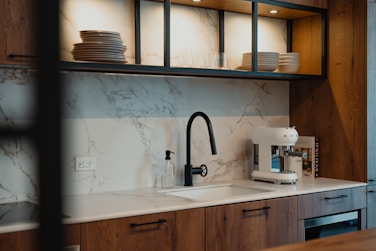 Modern kitchen sink with coffee maker and dishes