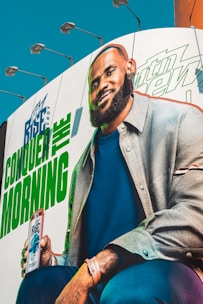 Lebron james holding a rise energy drink can.
