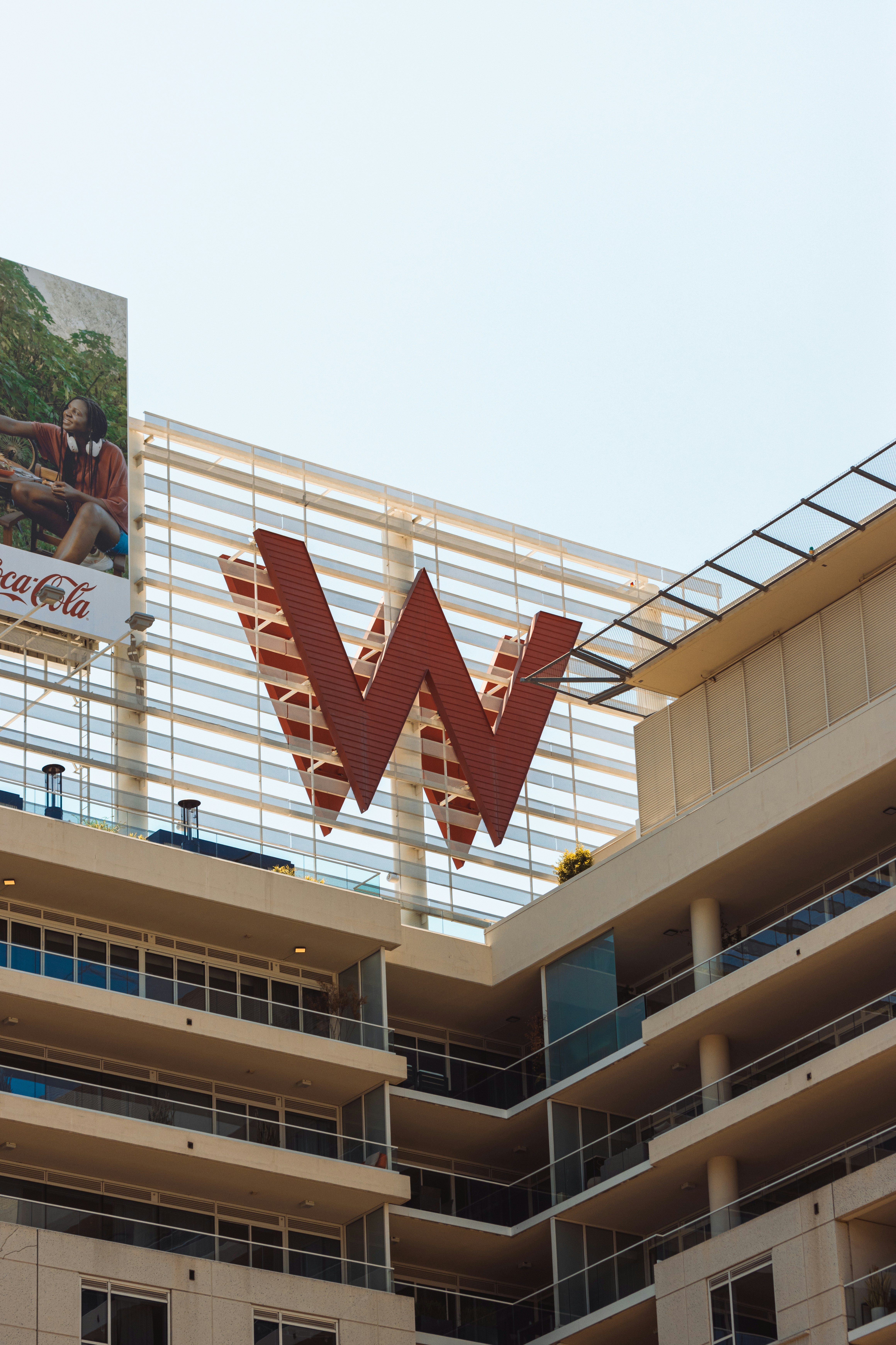Large red w logo on modern building exterior photo – Free Cityscape ...