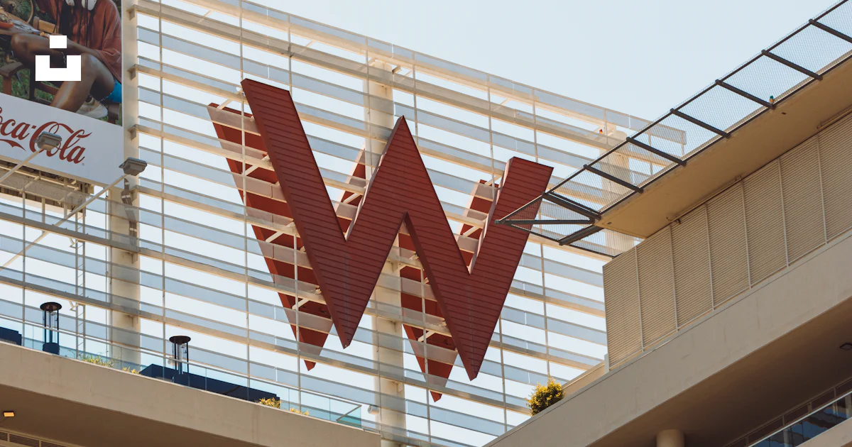 Large red w logo on modern building exterior photo – Free Cityscape ...