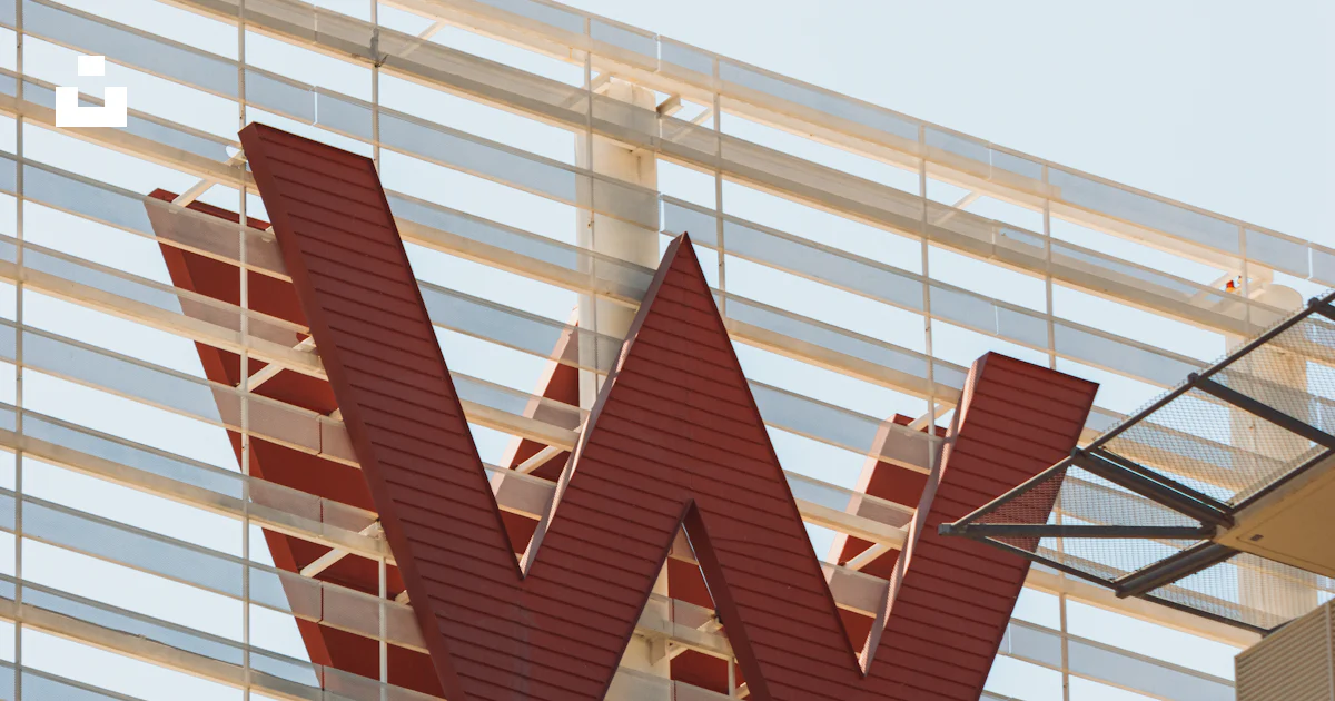 Large red w logo on a modern building photo – Free Architecture Image ...