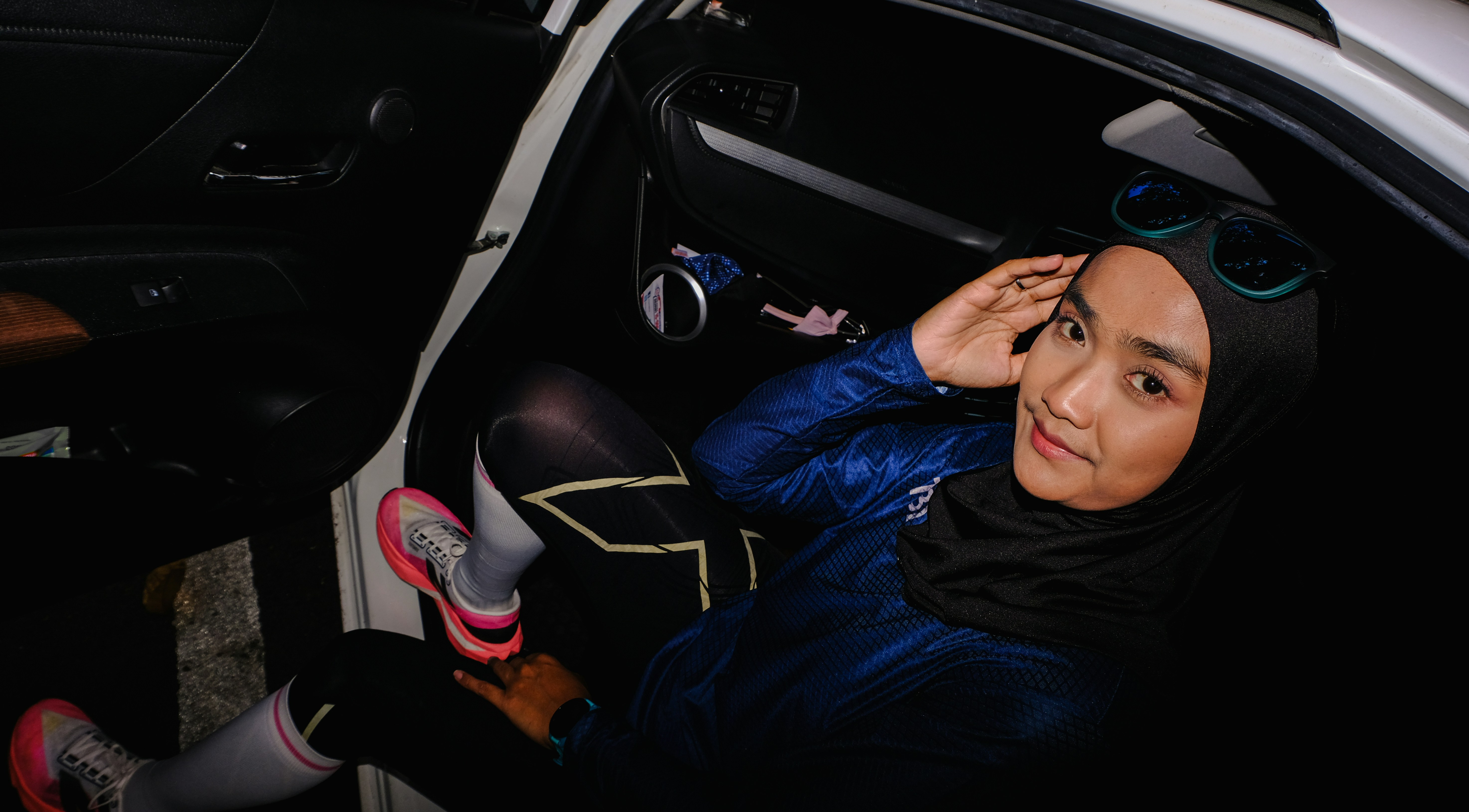 Woman in hijab sitting in a car