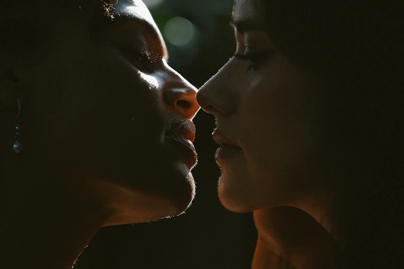 Two women connecting outdoors with intimacy