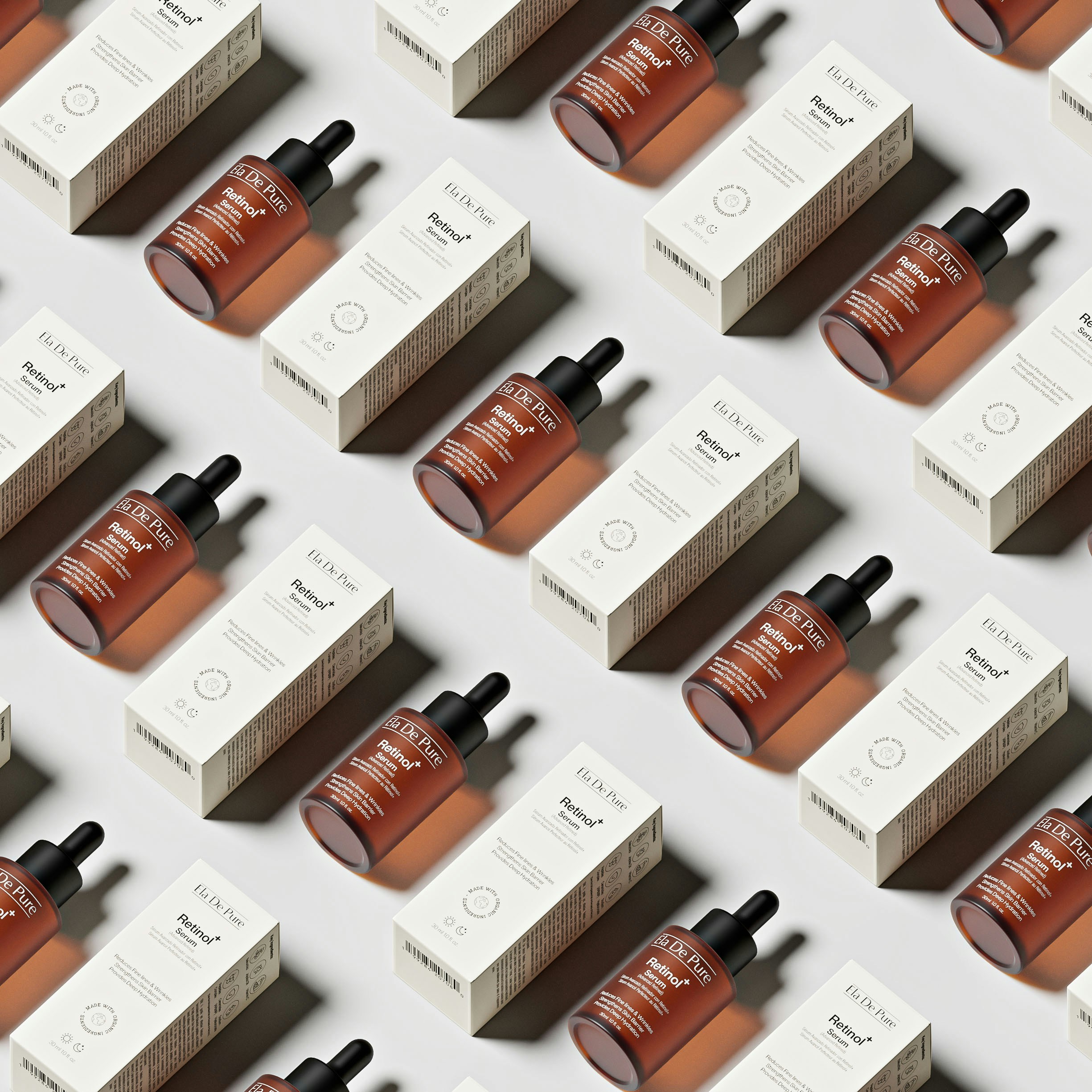 Bottles of serum and their boxes arranged diagonally