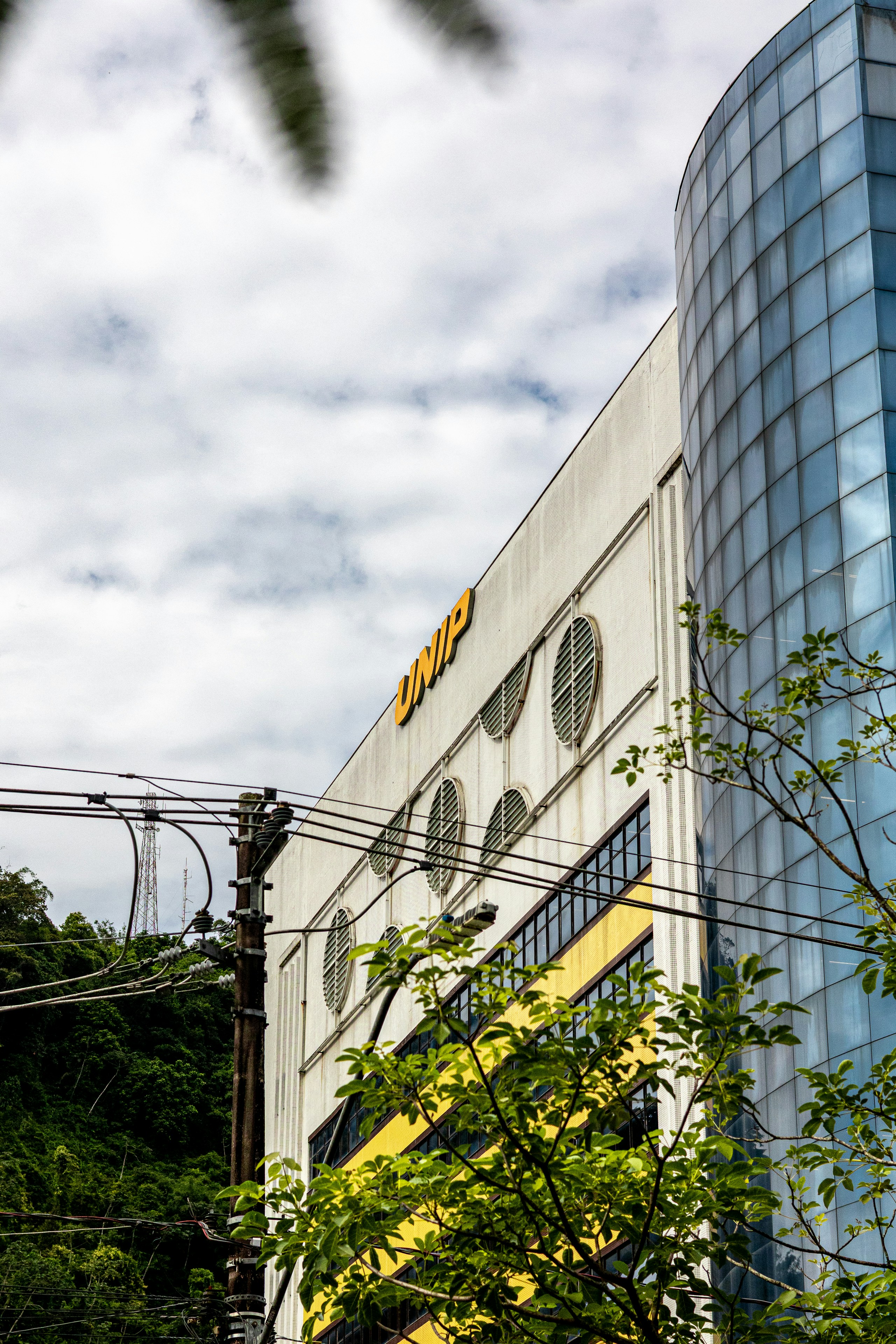 Modern building with yellow accents and glass facade