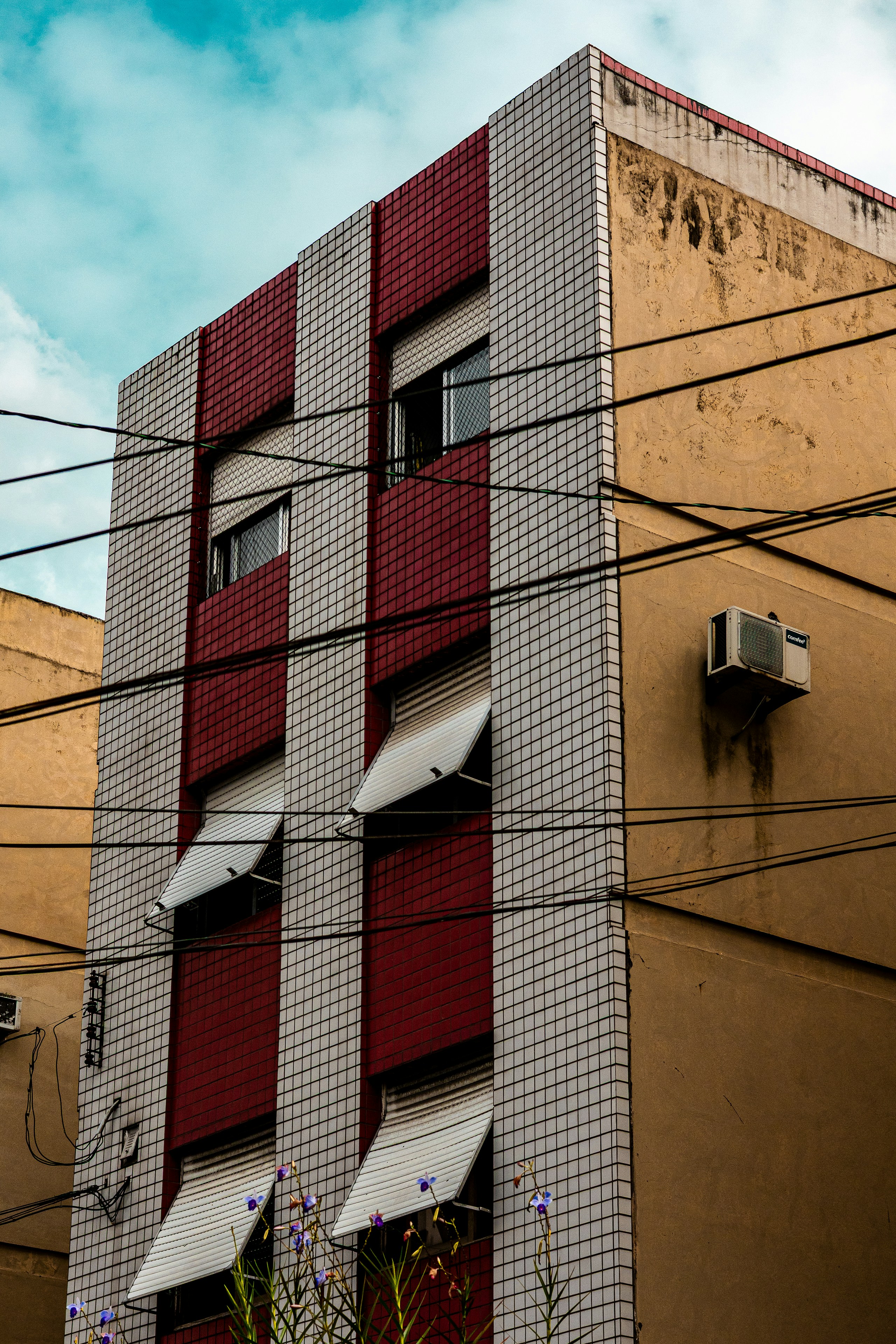 Modern building with red and white checkered facade