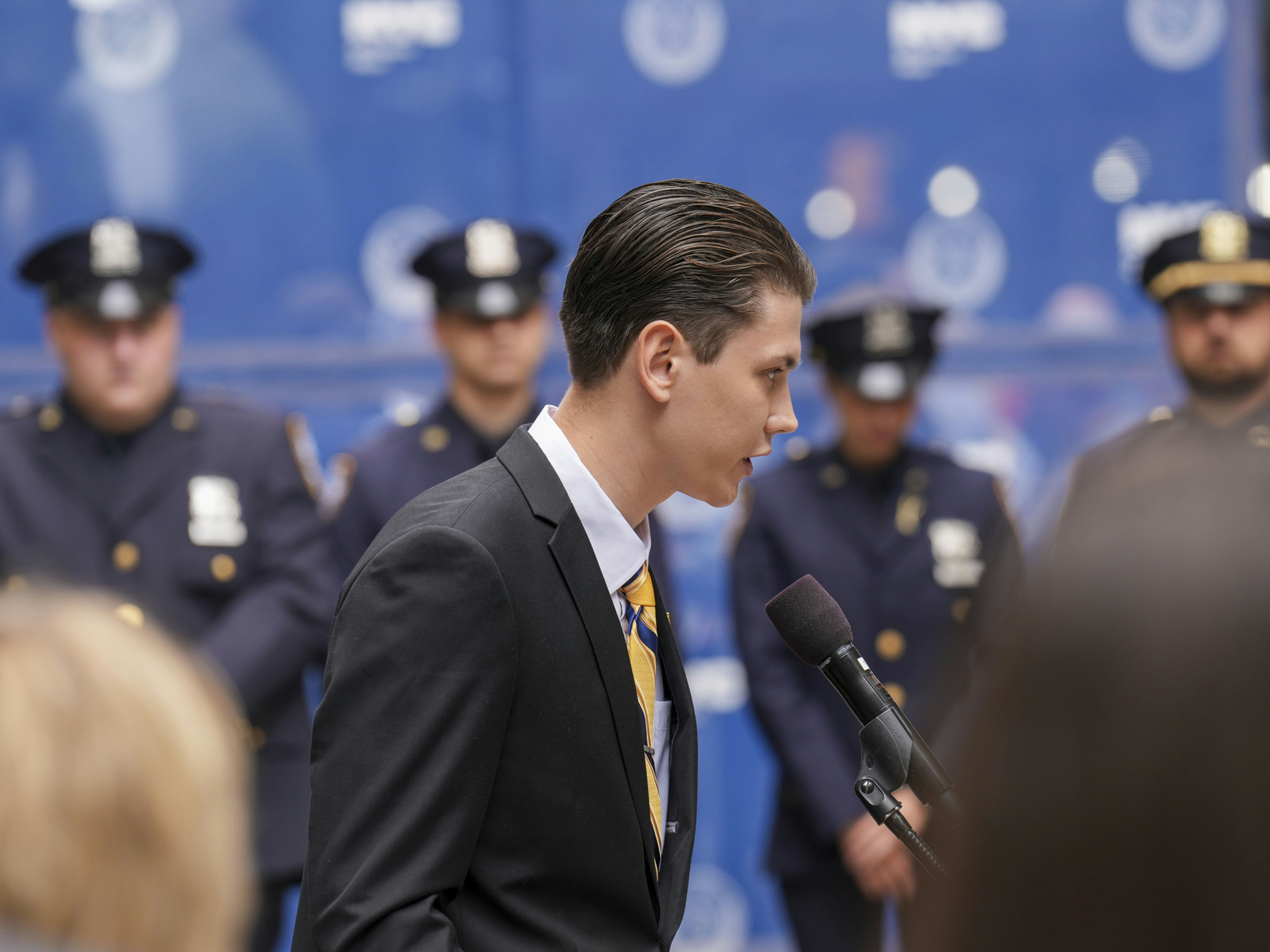 Omar Abdullah in a thoughtful pose during a meeting, with a diverse group of religious leaders in the background, depicting serious discussion.
