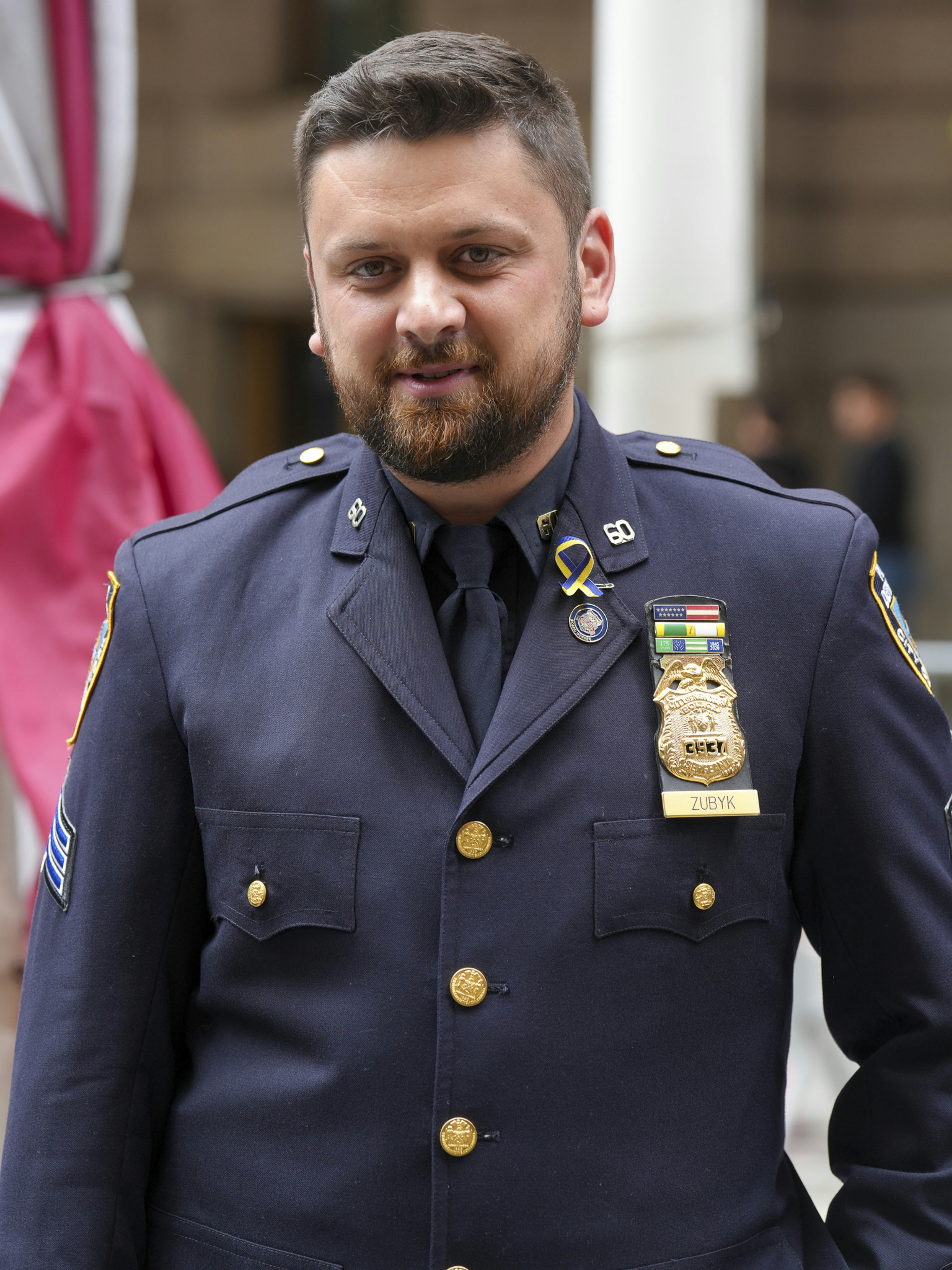 Police officer in uniform with medals and badge