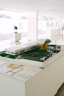 Architectural model of a modern building with landscaping