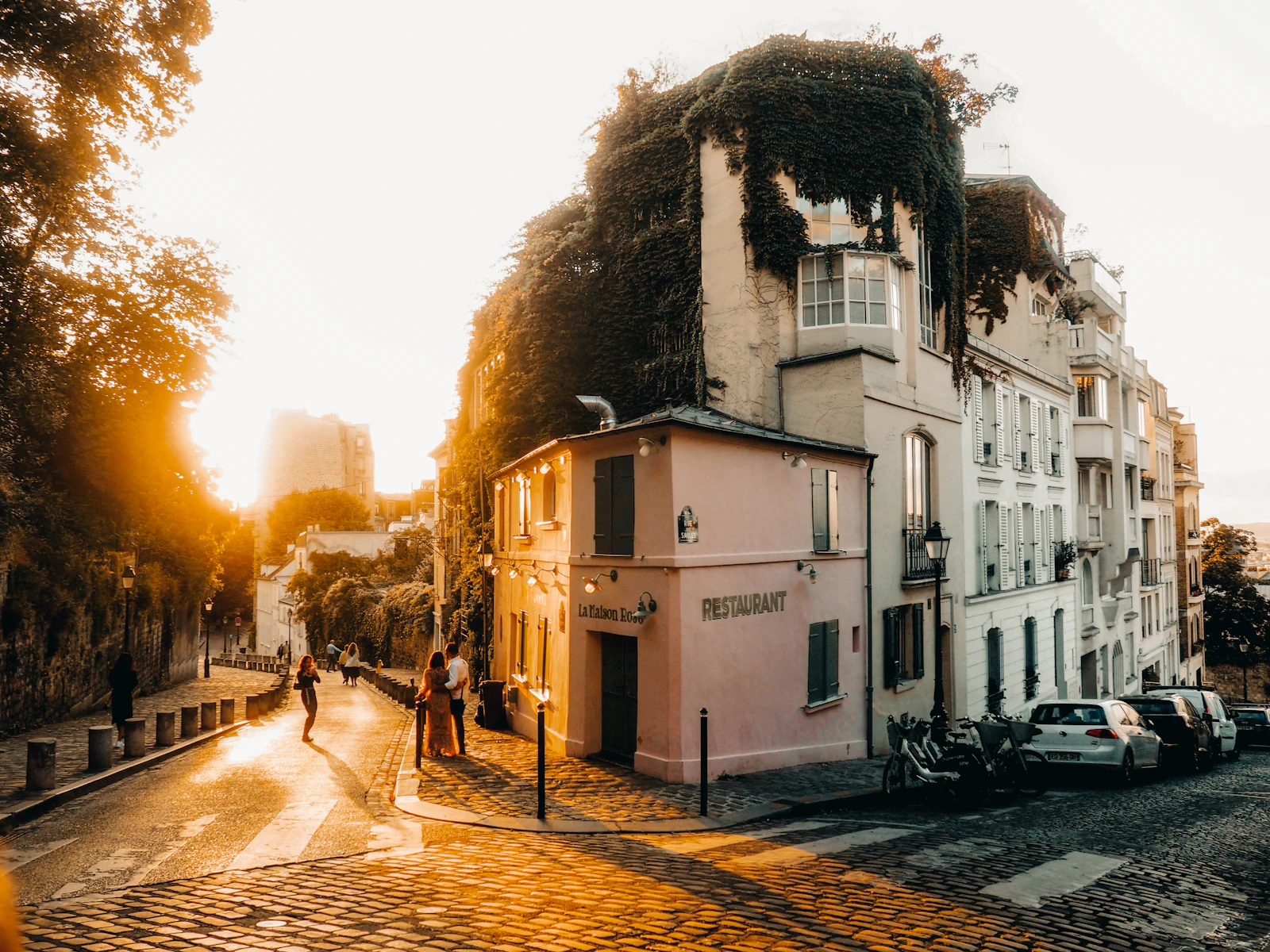 Cobblestone street in Montmartre, Paris, glowing in late afternoon sun