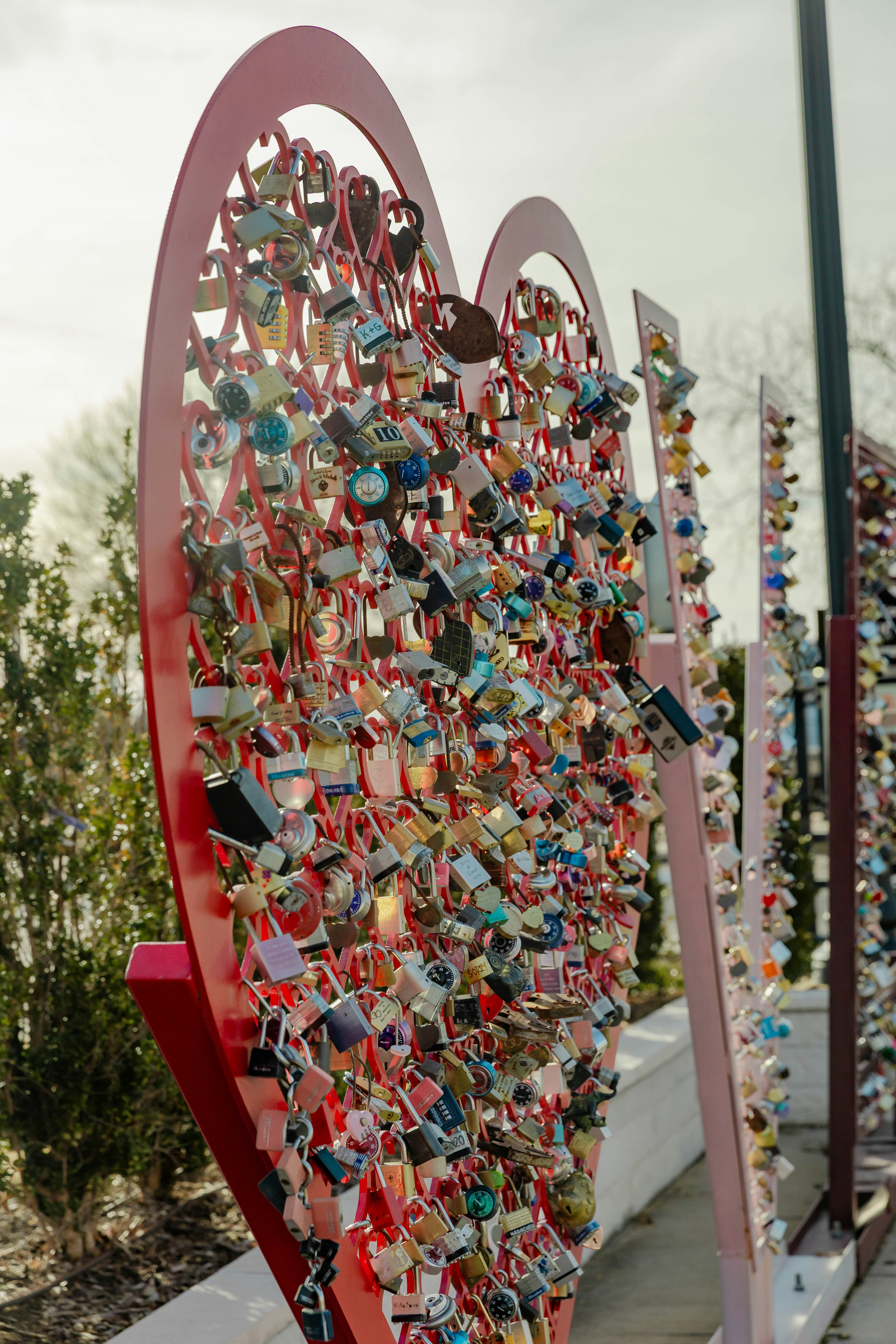 Heart-shaped sculpture covered in colorful love locks