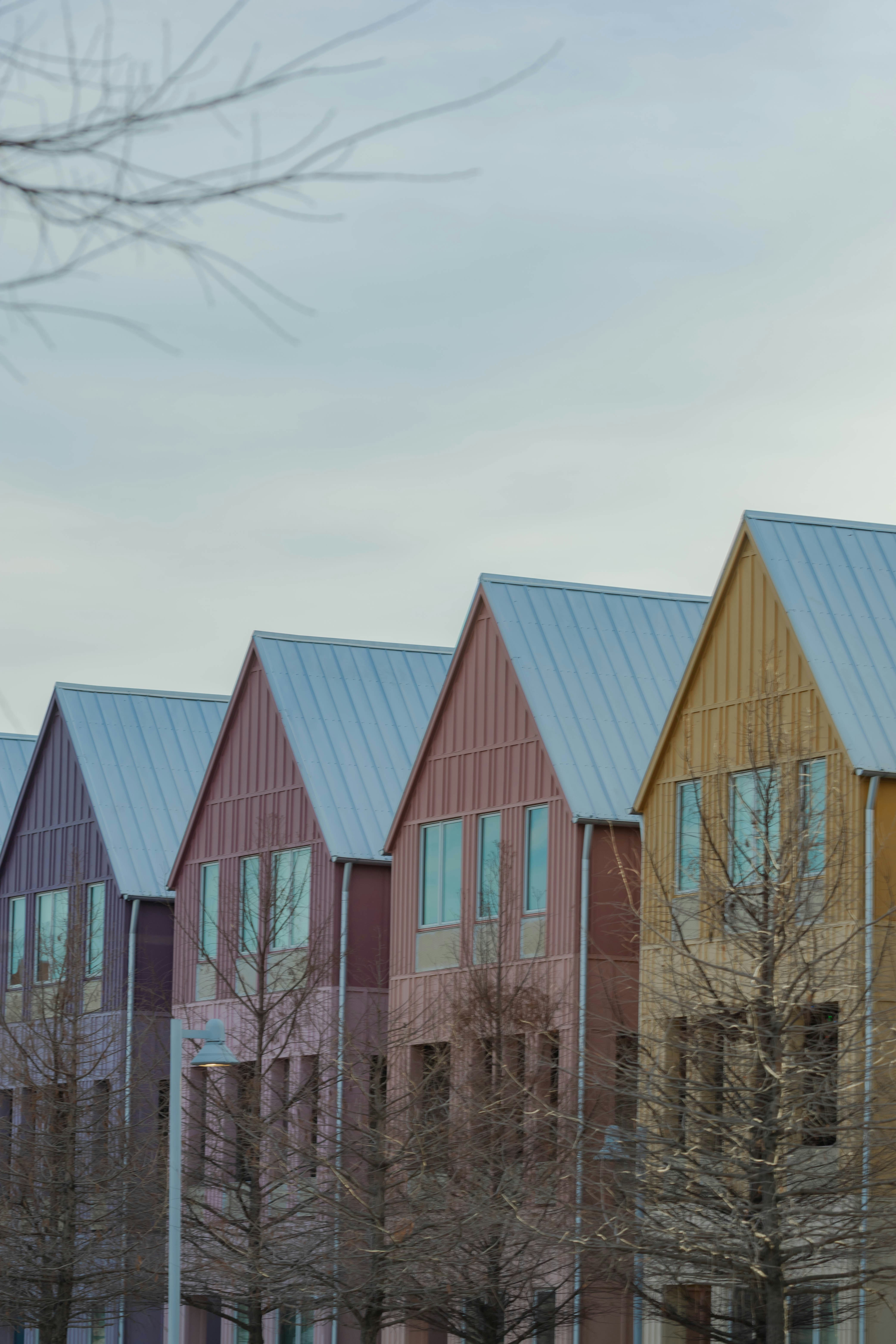 Row of modern houses with gabled roofs