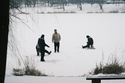 People gathered on a frozen, snow-covered lake.
