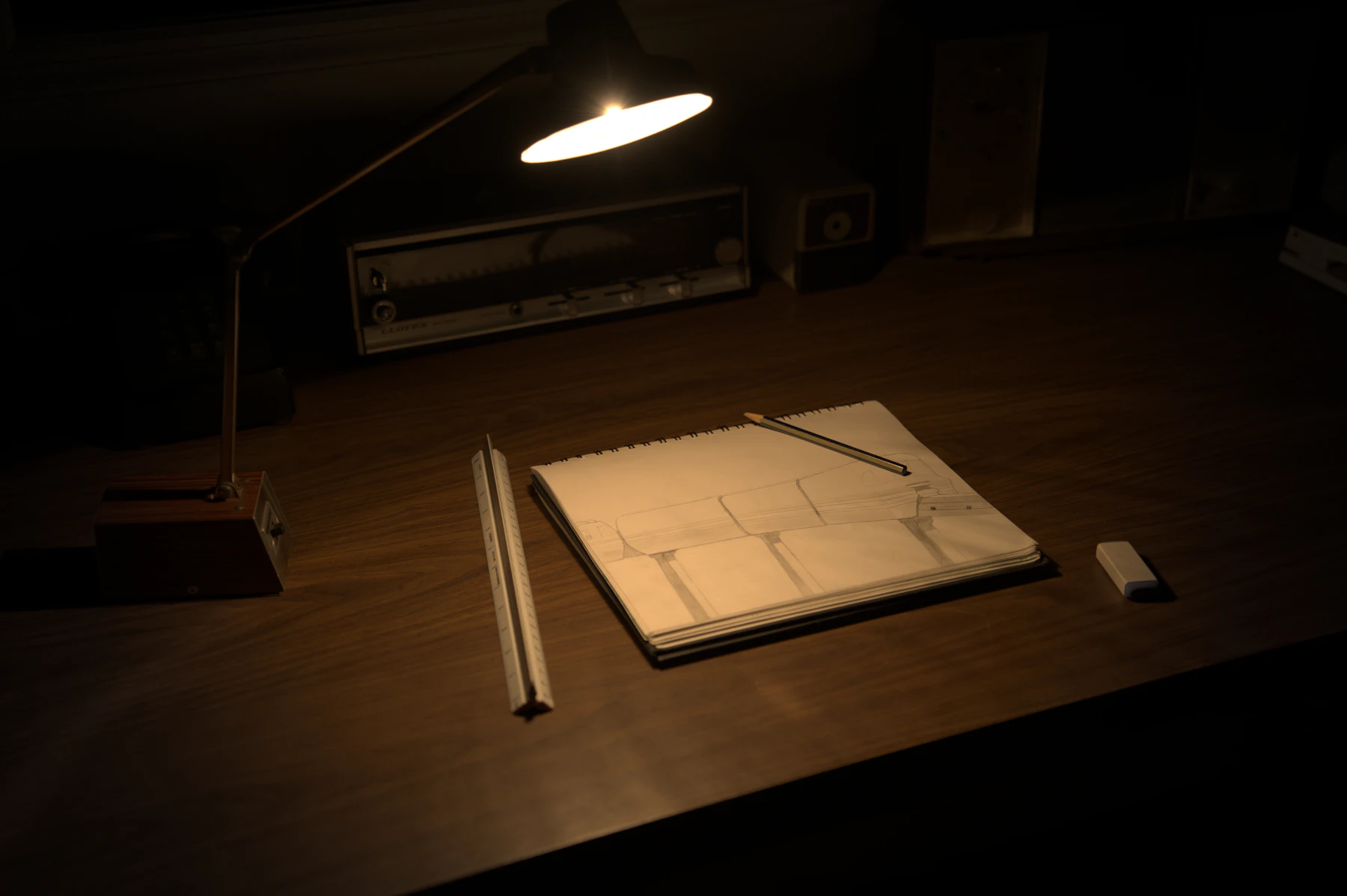 Sketchbook and pencils on a creative desk