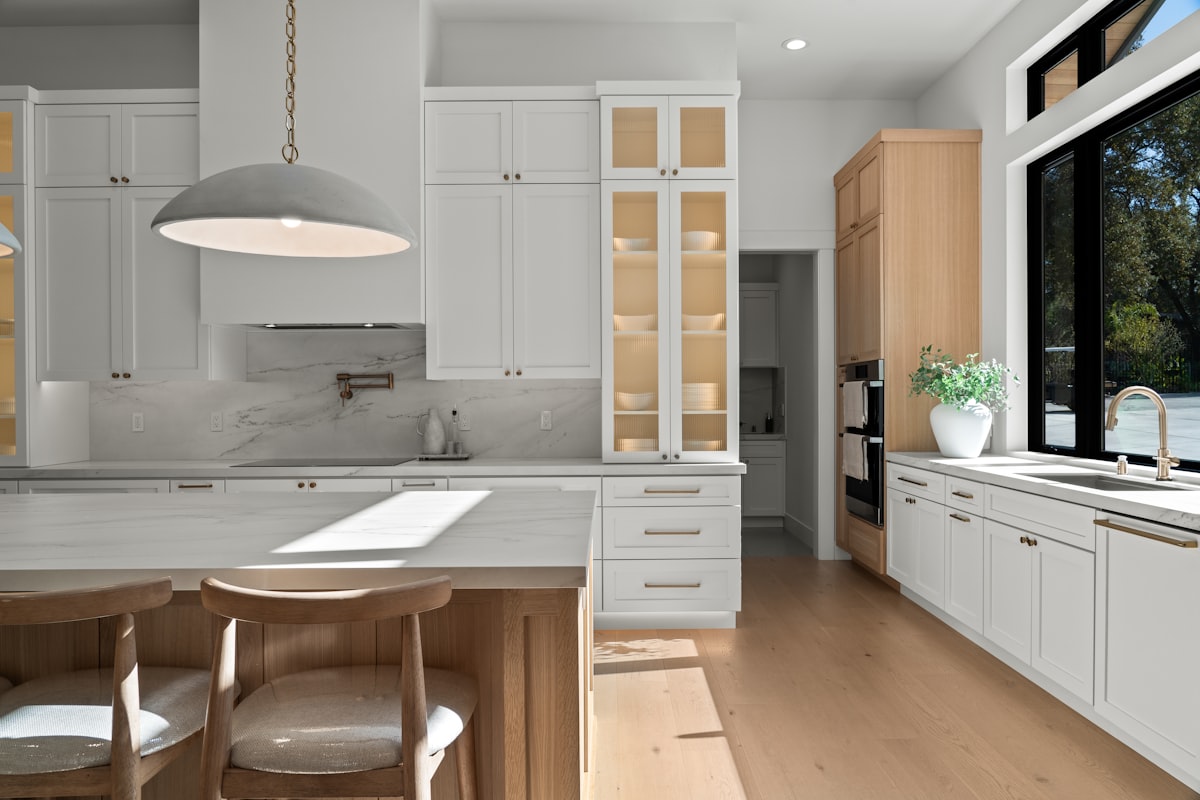Modern kitchen remodel with white cabinets and quartz countertops