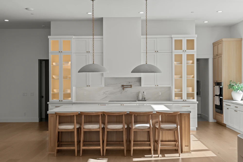 Bright modern kitchen with large island and pendant lighting