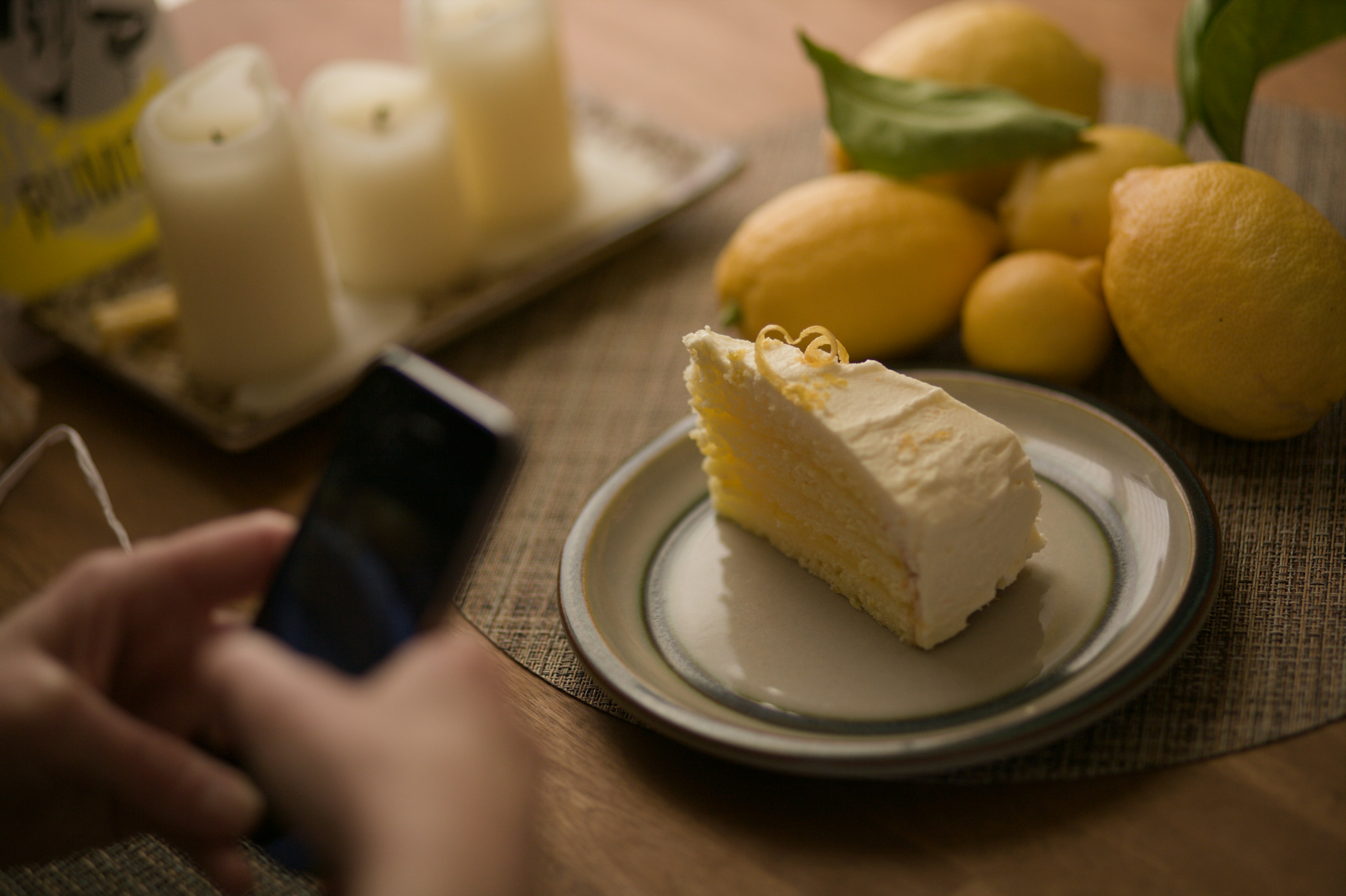 Slice of lemon cake with fresh lemons