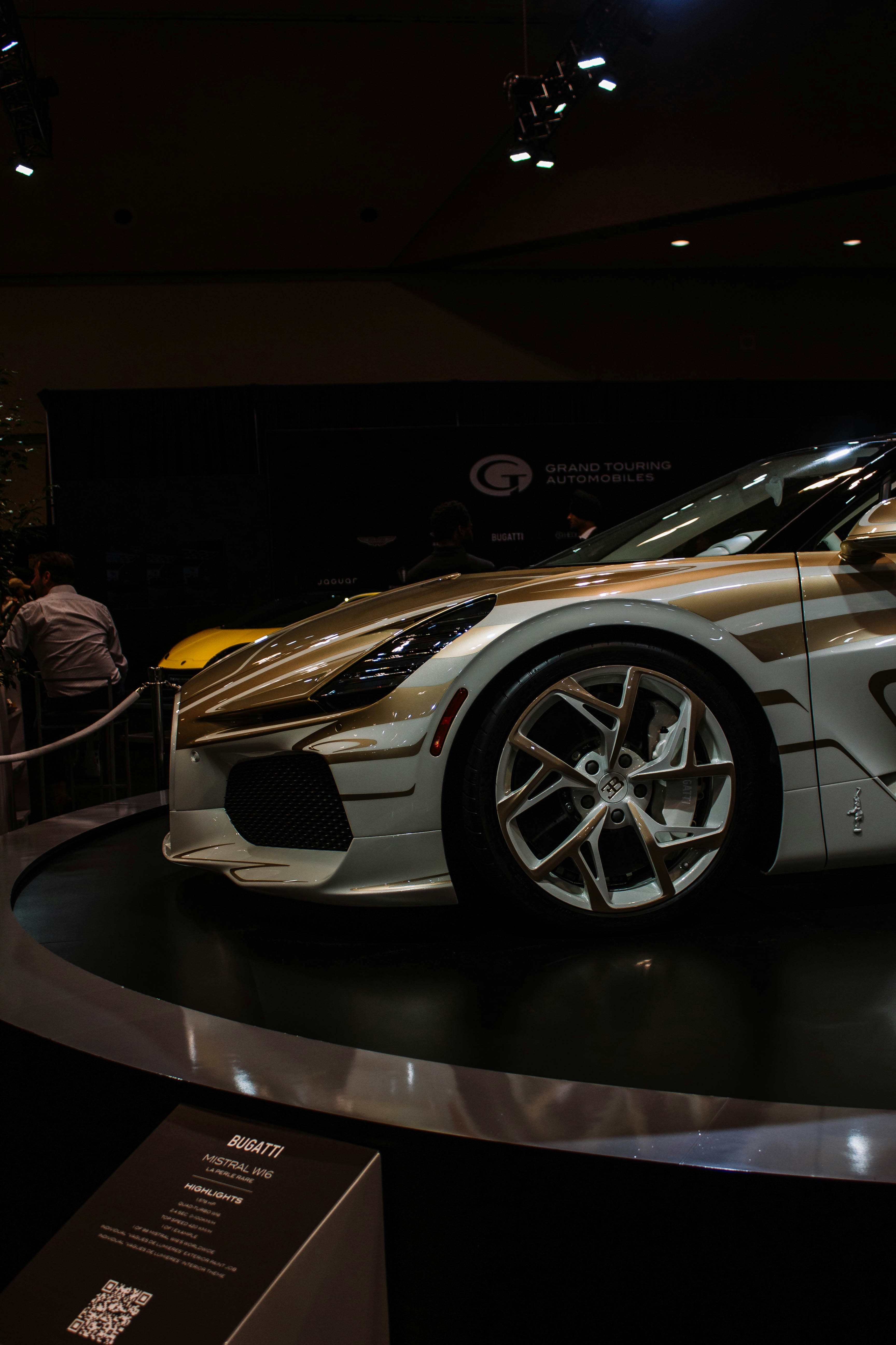 A custom sports car with unique gold accents on display