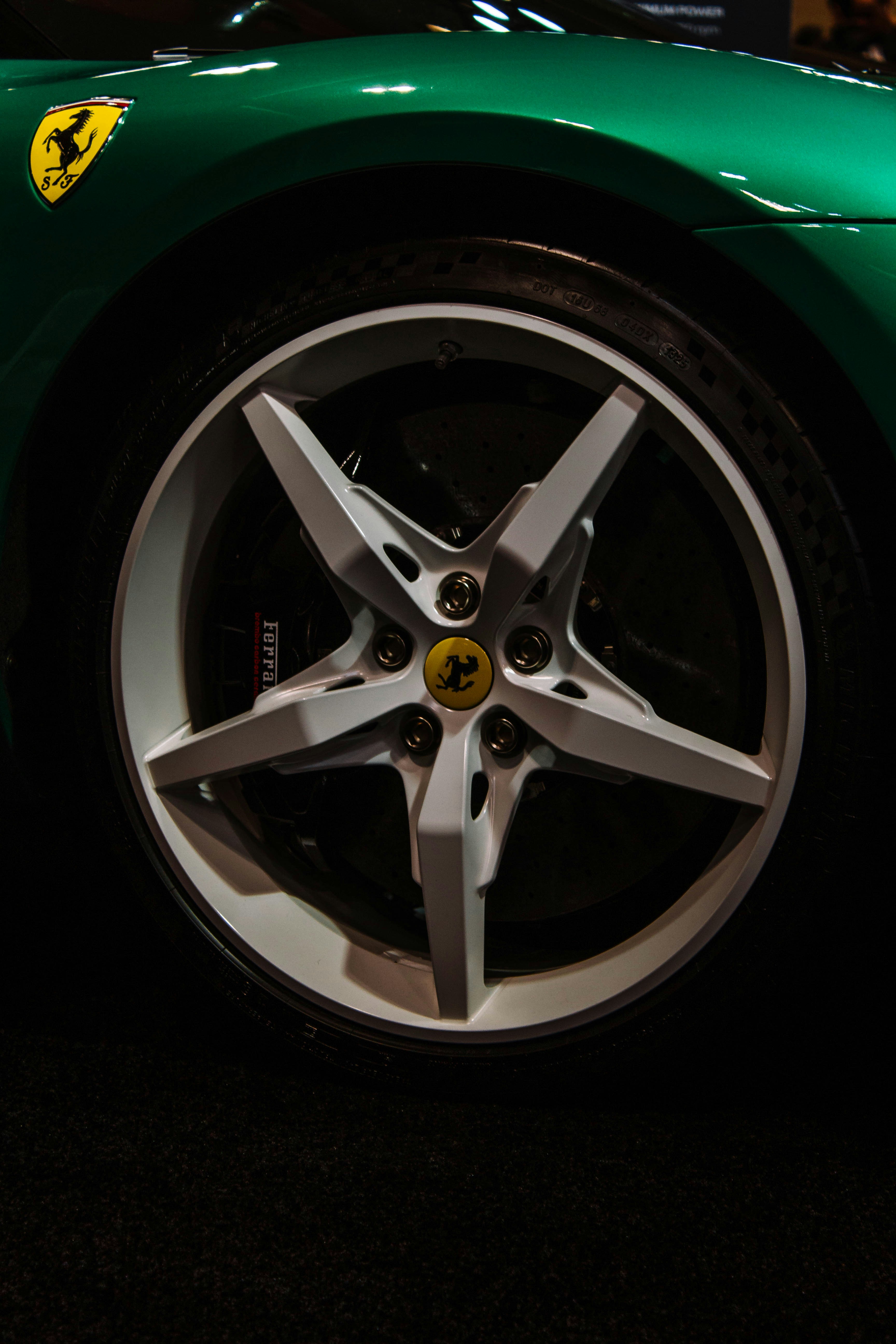 Green sports car wheel with five spokes