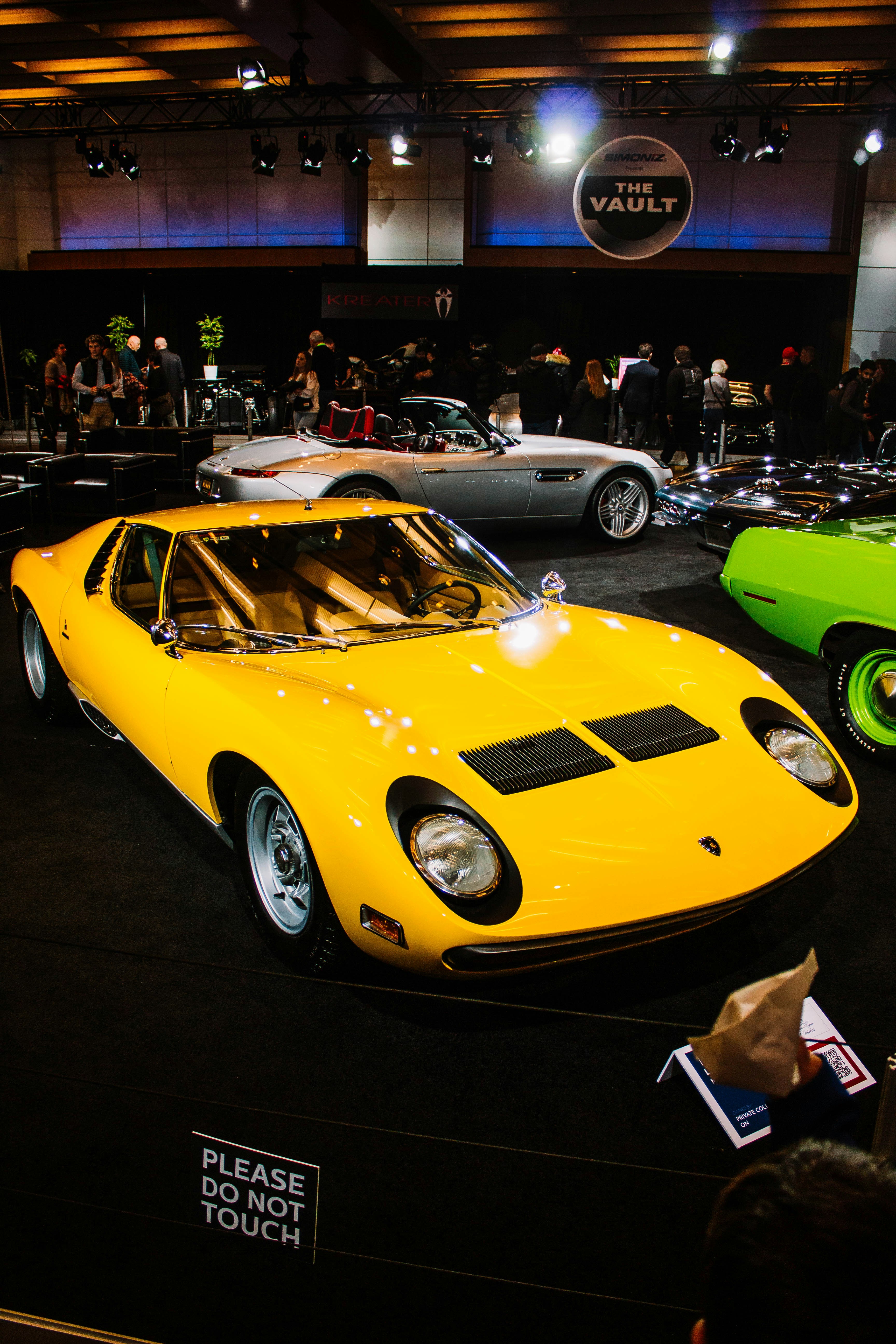 Yellow vintage lamborghini on display at auto show