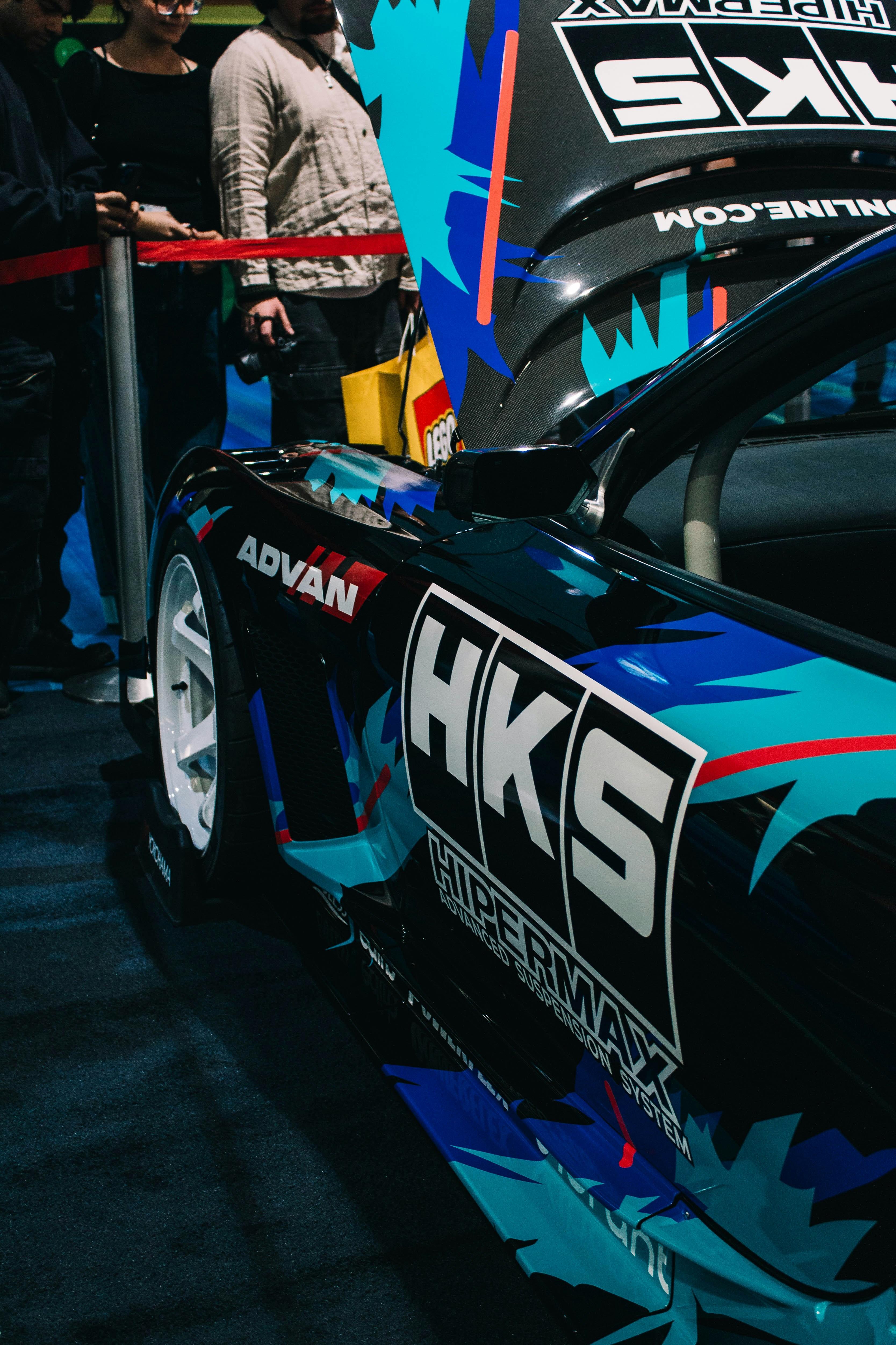 A customized sports car with hks branding.