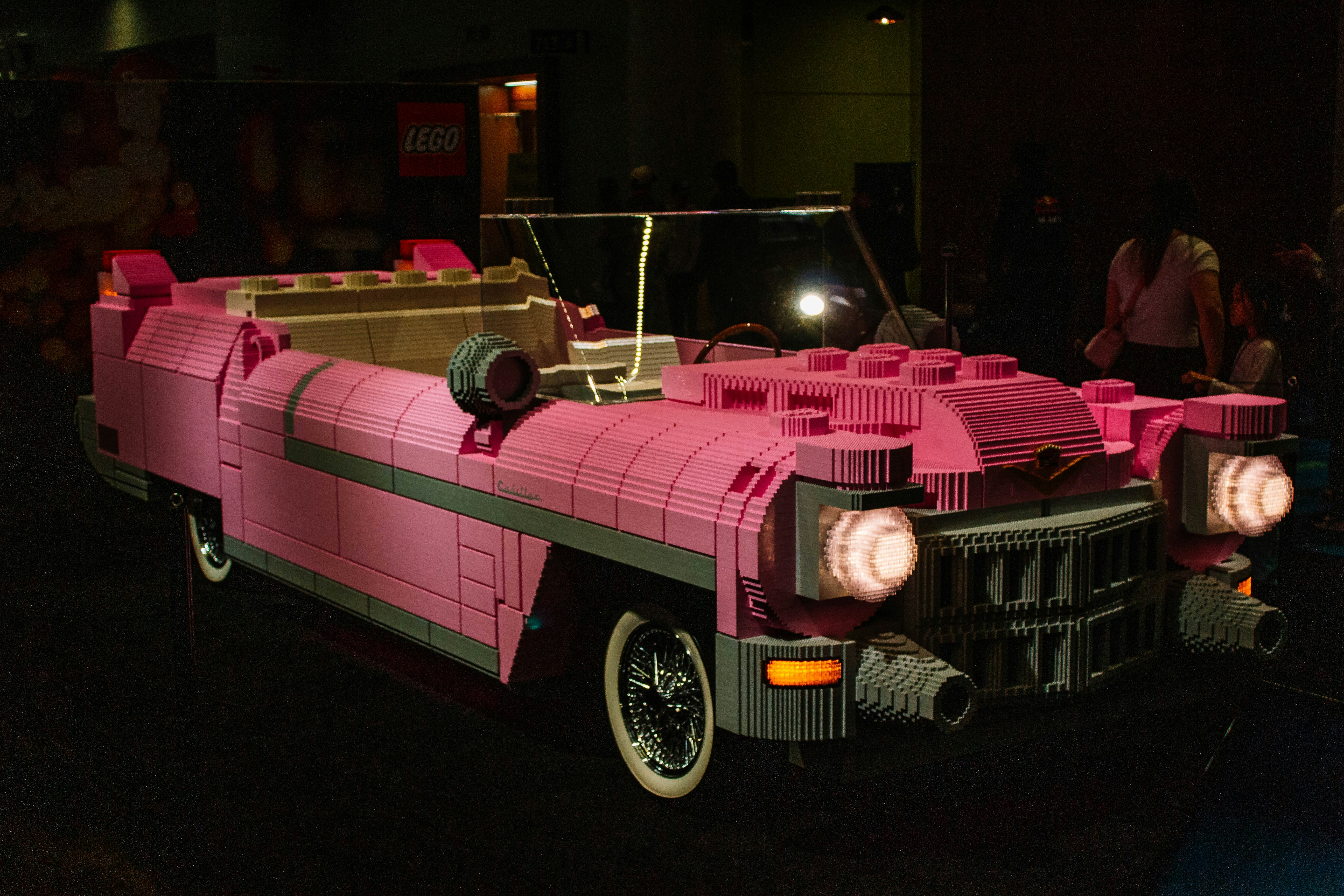 Pink lego car with headlights on