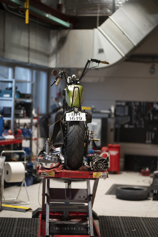 Motorcycle being worked on in a workshop.