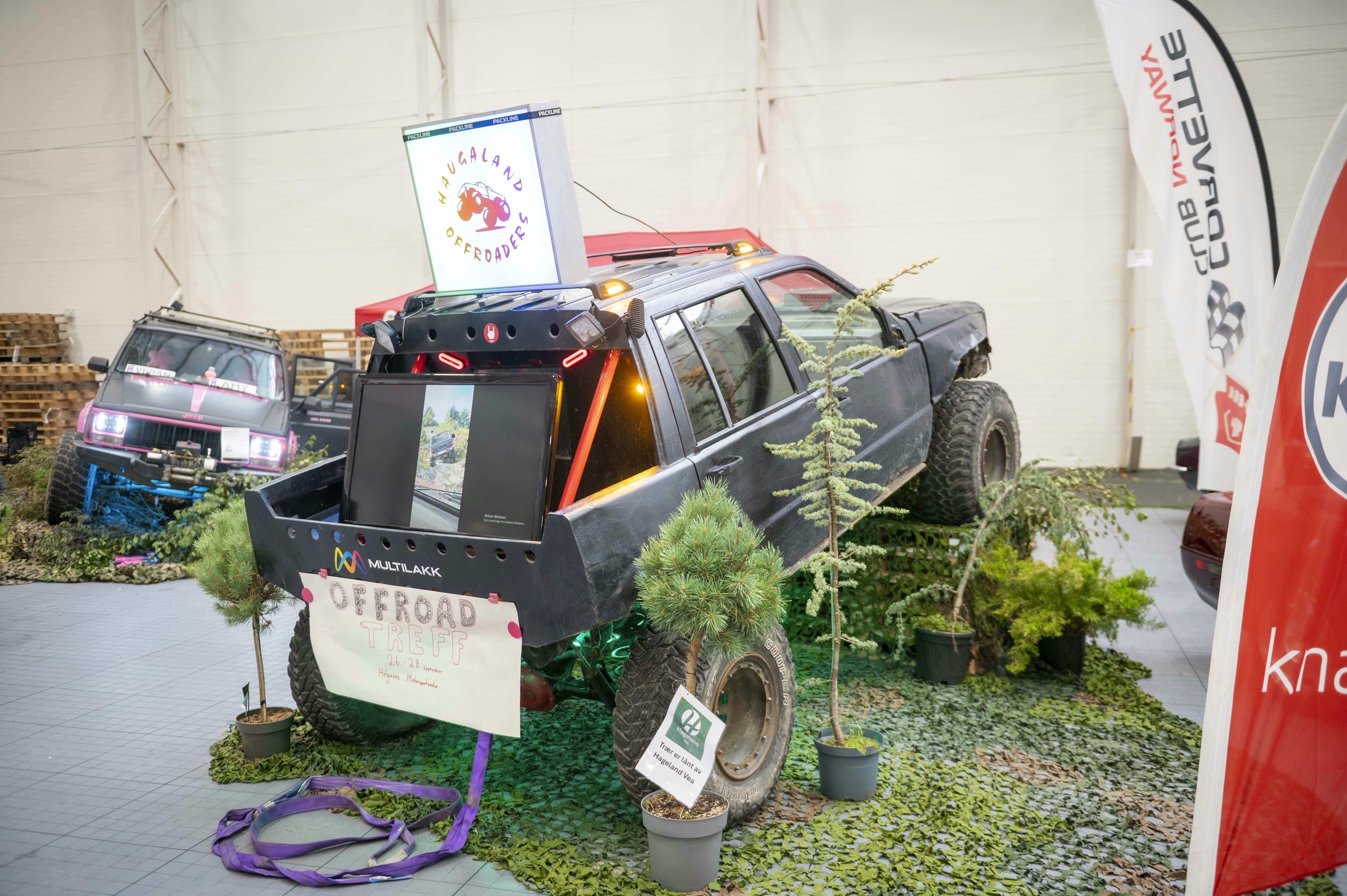 Modified offroad vehicle with display screen and plants