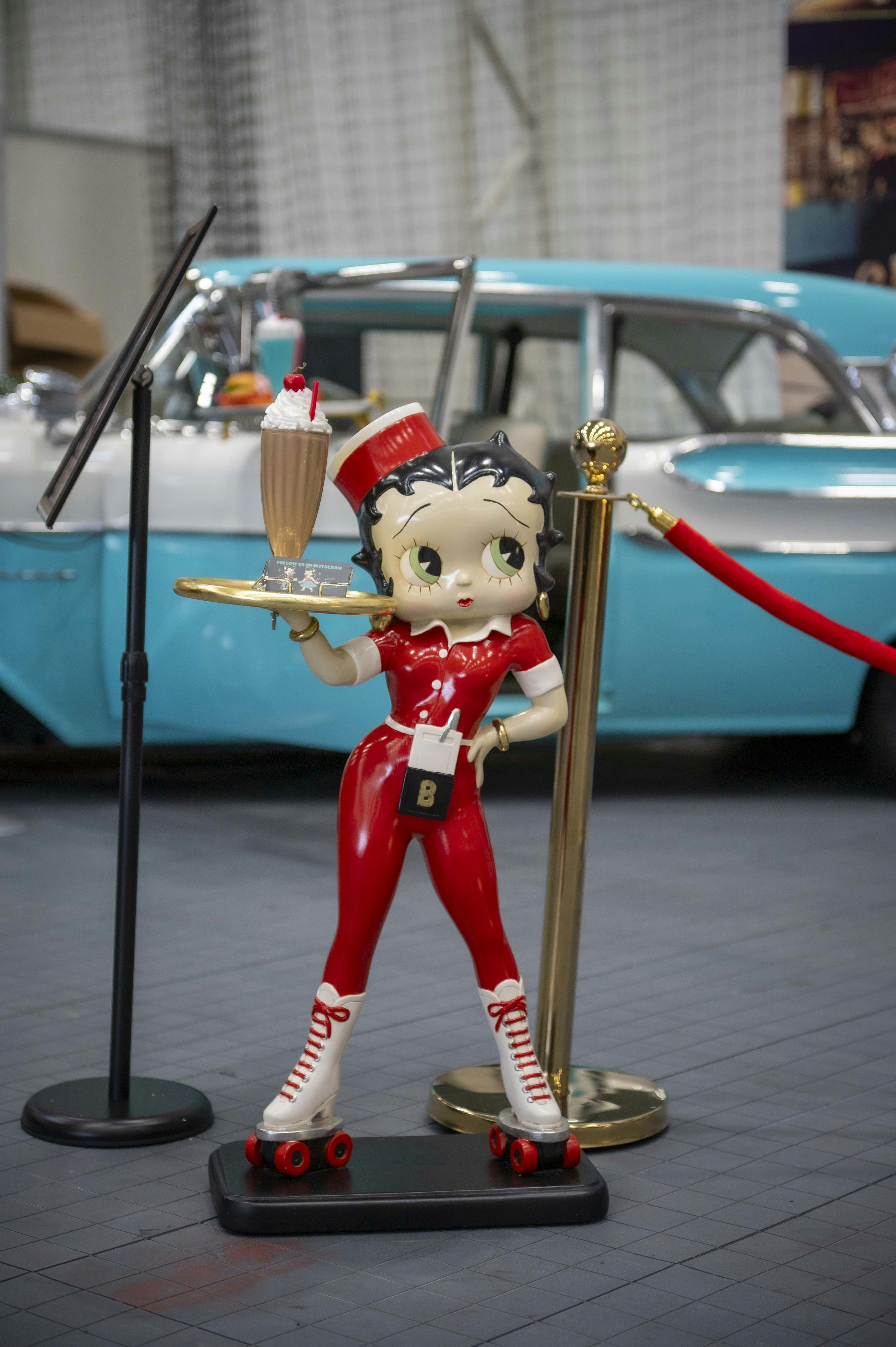 Betty boop figurine in a red outfit with roller skates