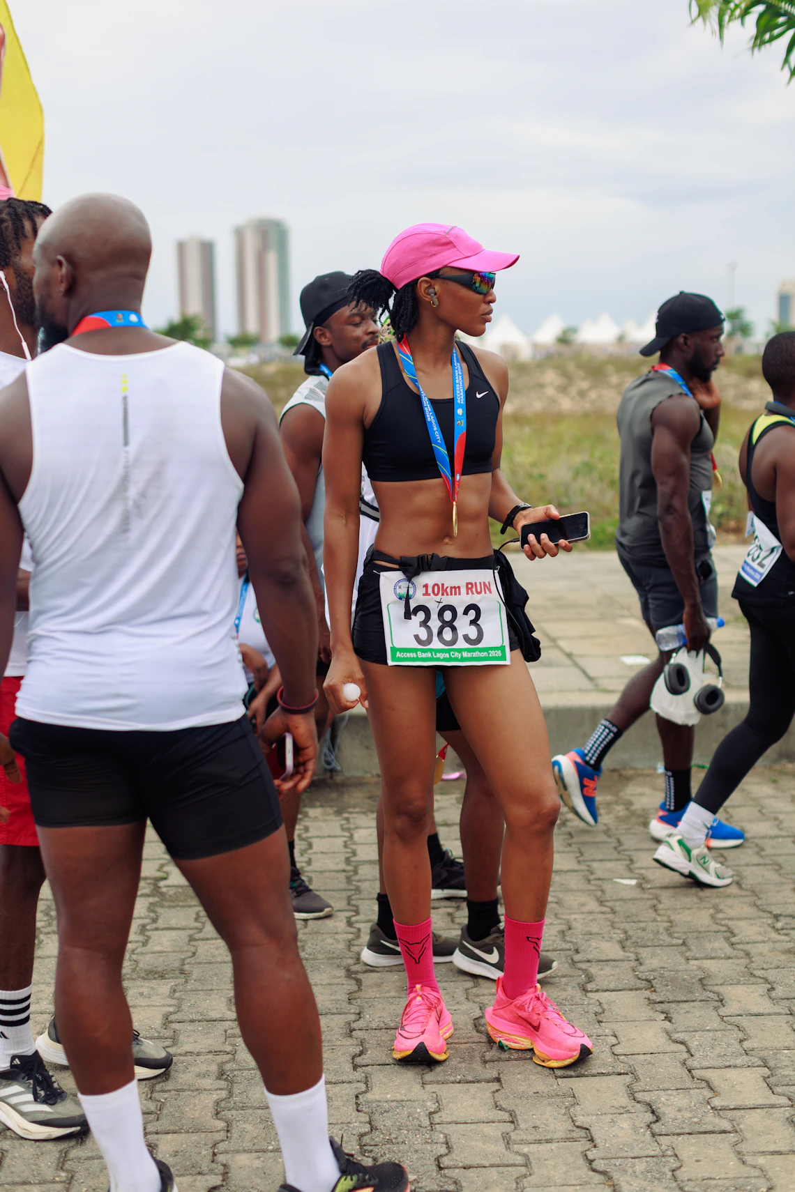 Female athlete at a running event in technical athletic wear