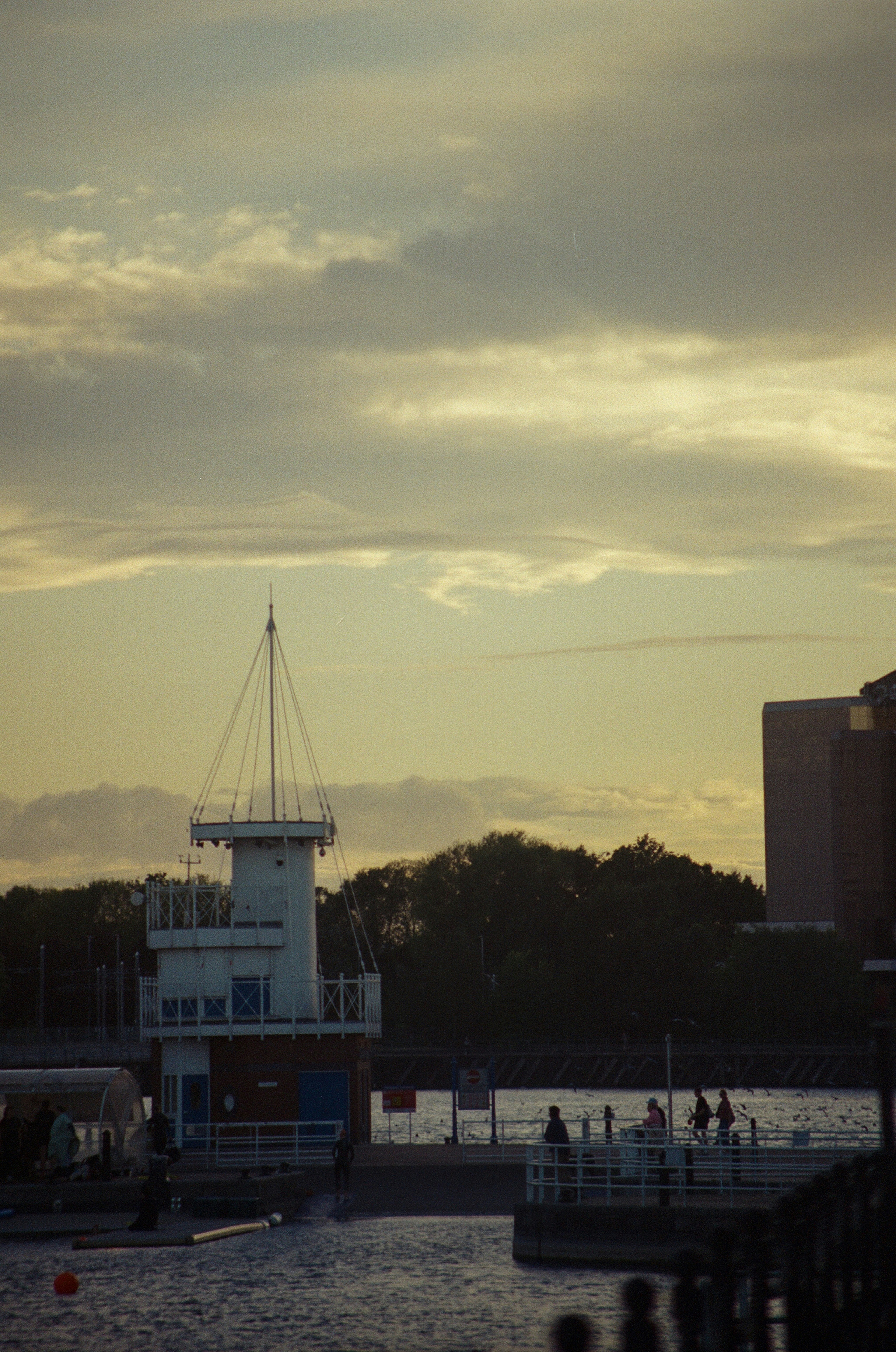 Boathouse structure by the water at dusk
