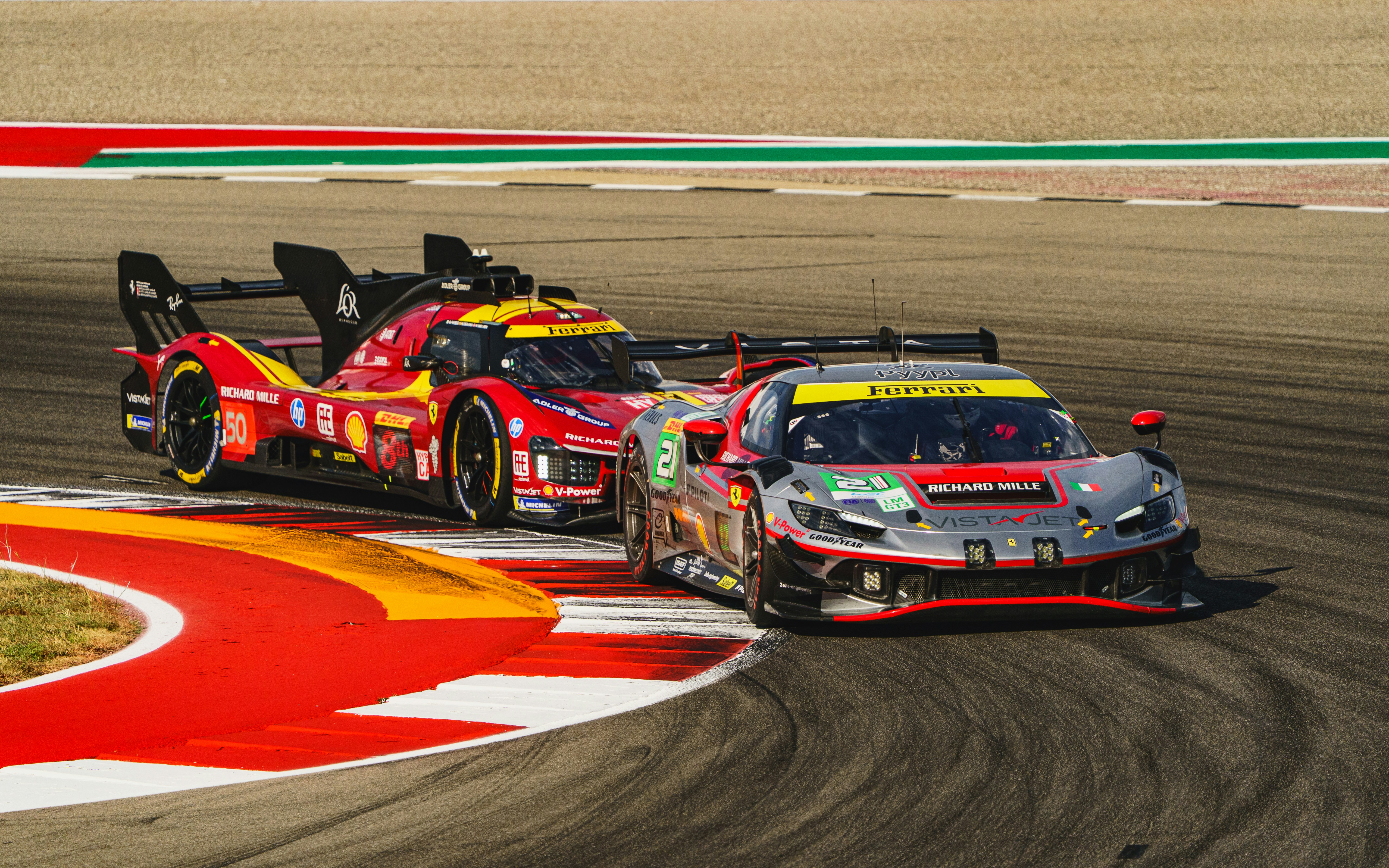 Two sports cars racing on a track photo – Free Sports car Image on Unsplash