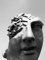 Sculpture of a head filled with debris