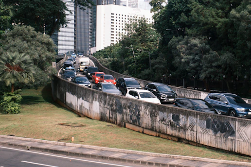 Cars stuck in traffic on a highway overpass.